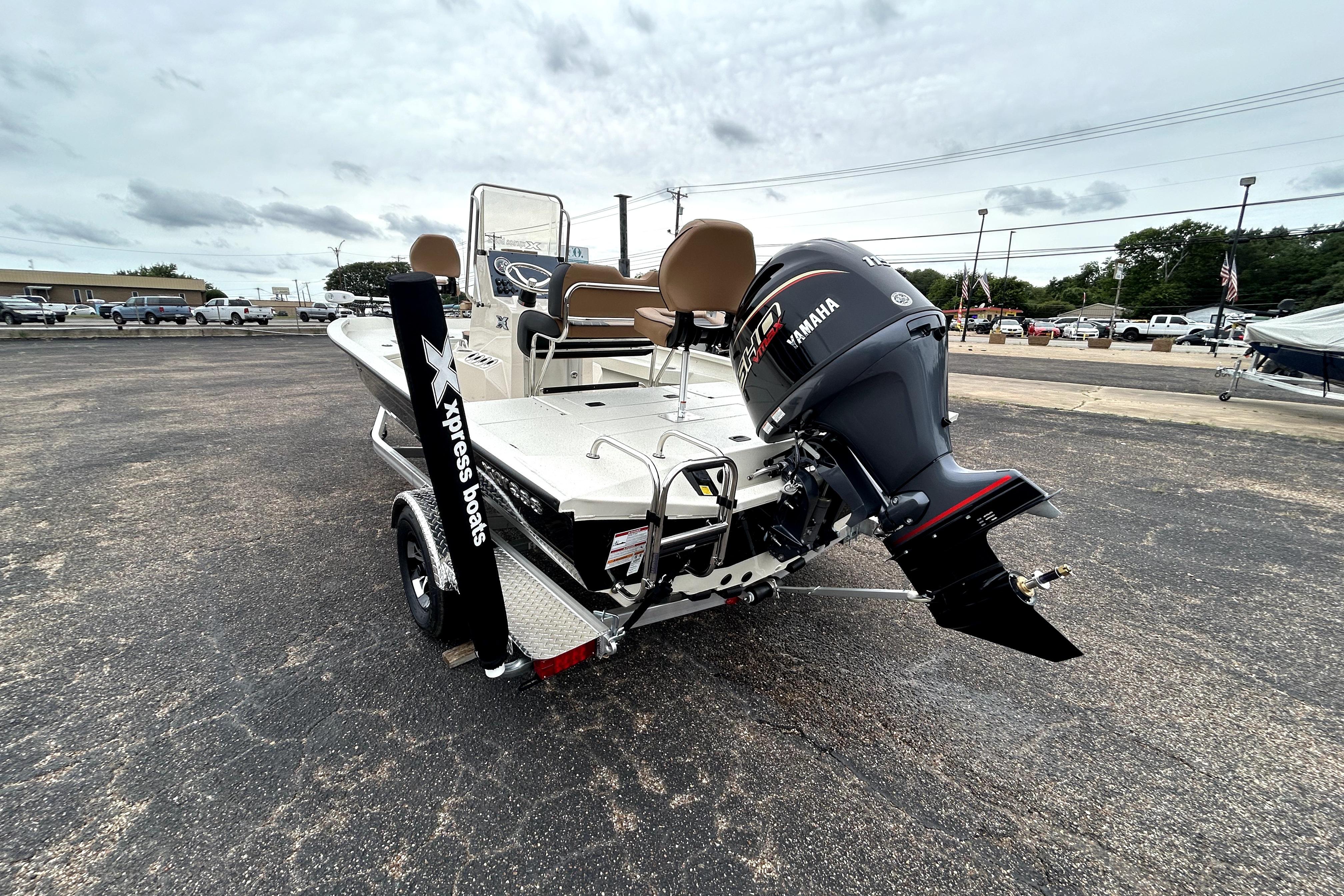 2026 Xpress H20B Bay boat with Yamaha engine in a parking lot.