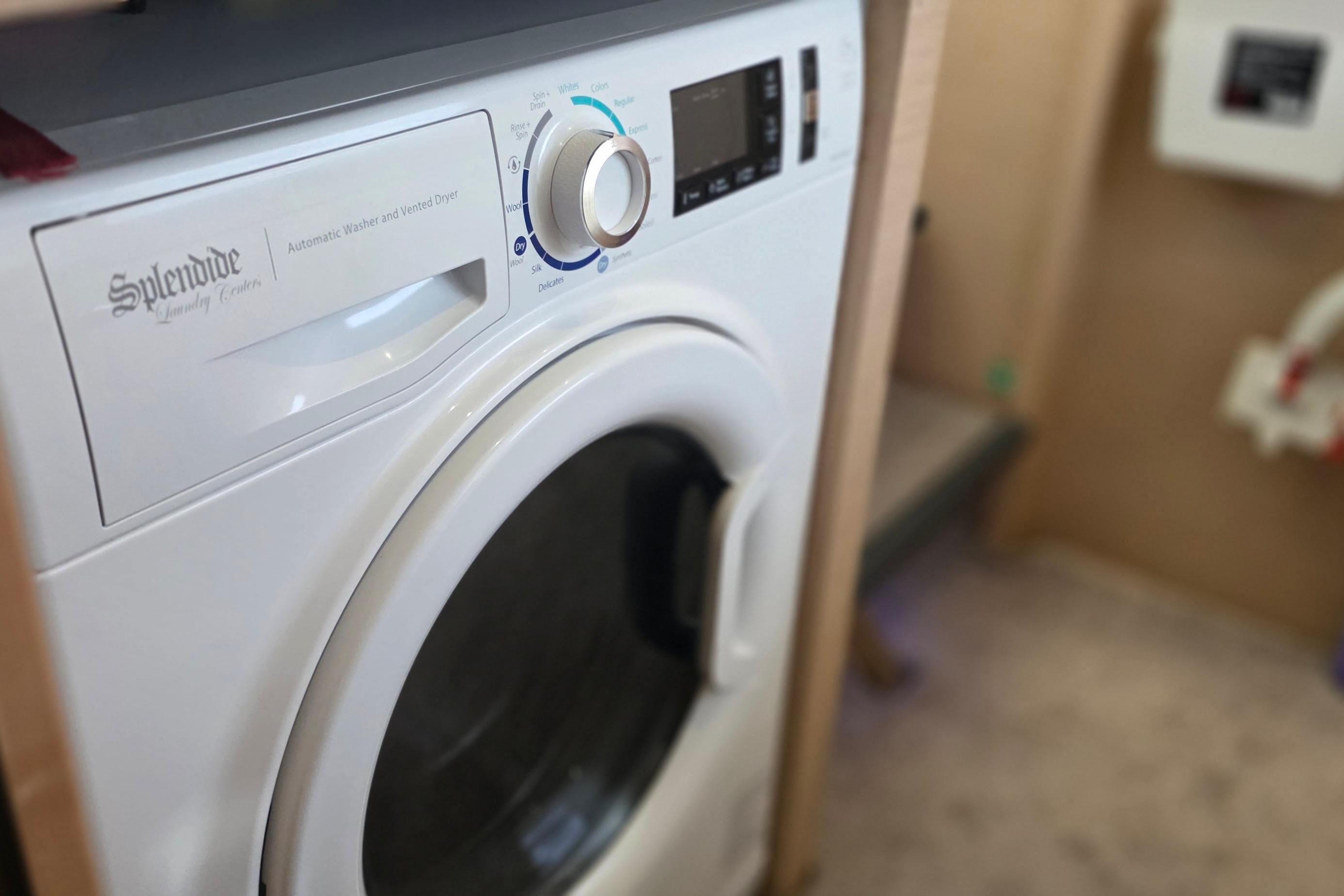 Splendide washer-dryer inside 2018 Fountaine Pajot Motor Yacht 44 laundry area.
