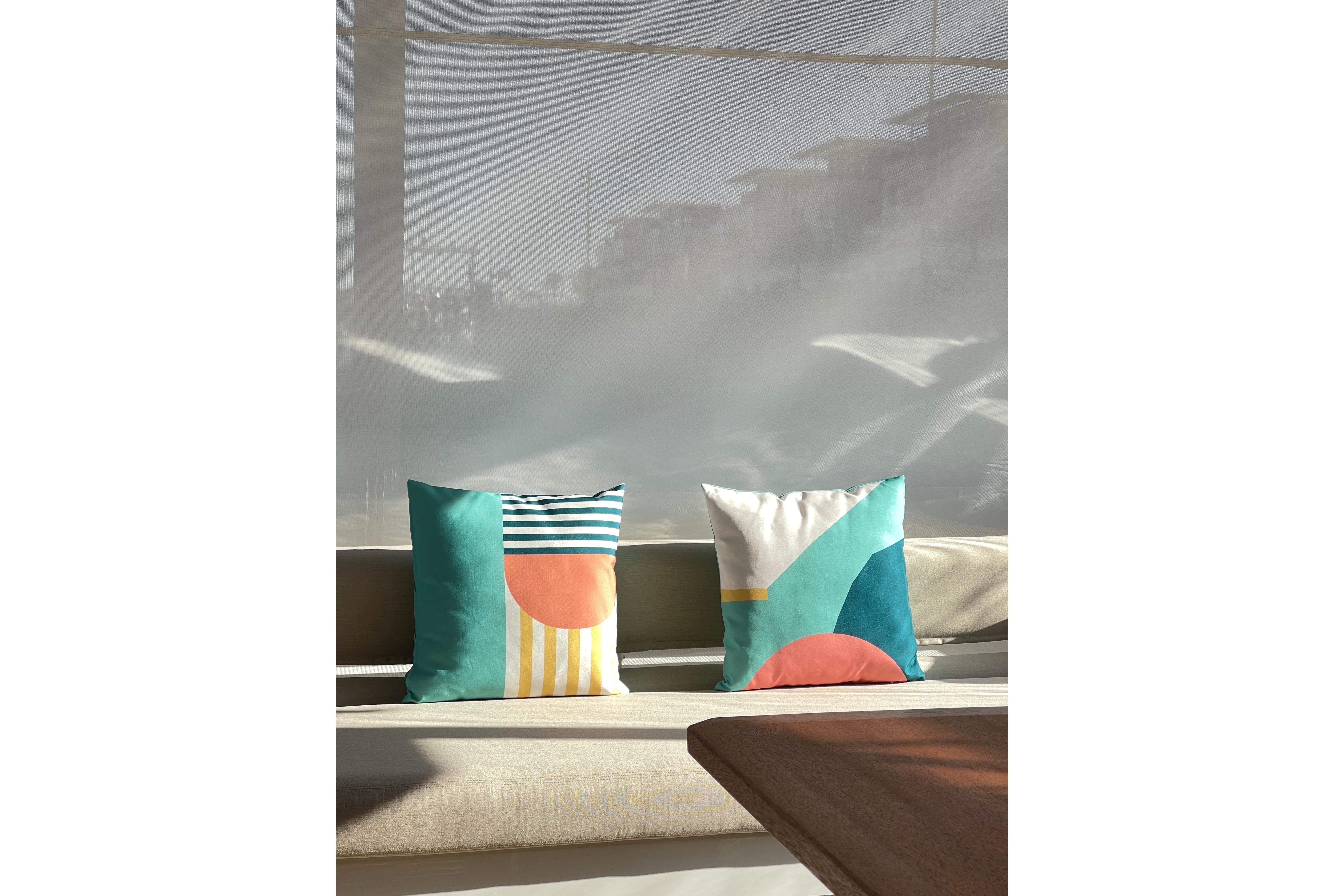 Colorful geometric pillows on Fountaine Pajot Samana 59 yacht, 2023 model.