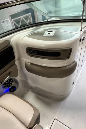 2023 Crownline Eclipse E235 XS interior with beige seating and modern dashboard design.