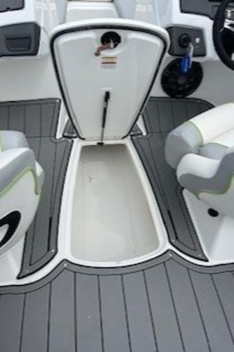 2024 Tahoe 210 Si boat interior with storage compartment and seating.