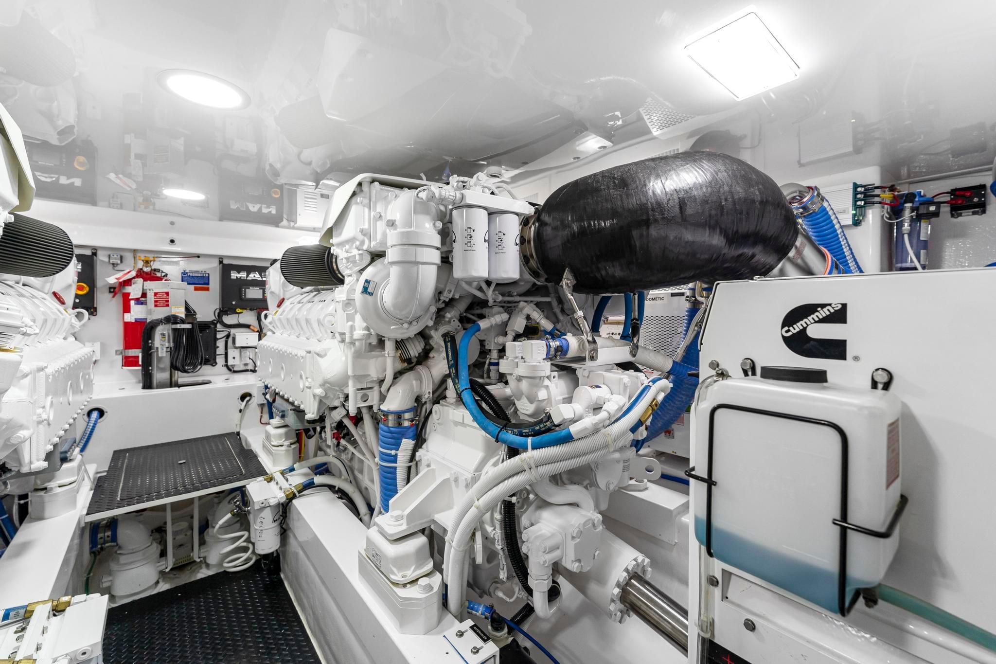 Engine room of 2025 Viking 58 Convertible yacht, featuring advanced machinery and Cummins components.
