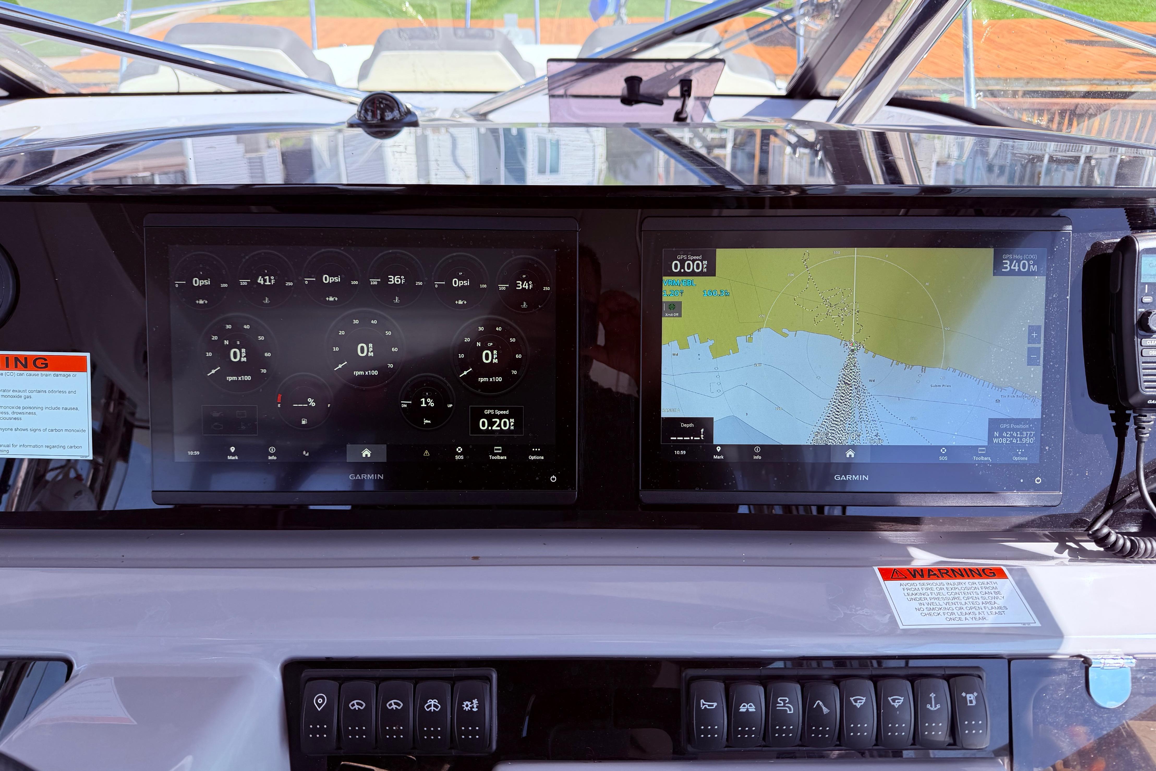 Dashboard of 2023 Jeanneau Leader 12.5 WA with Garmin navigation displays.