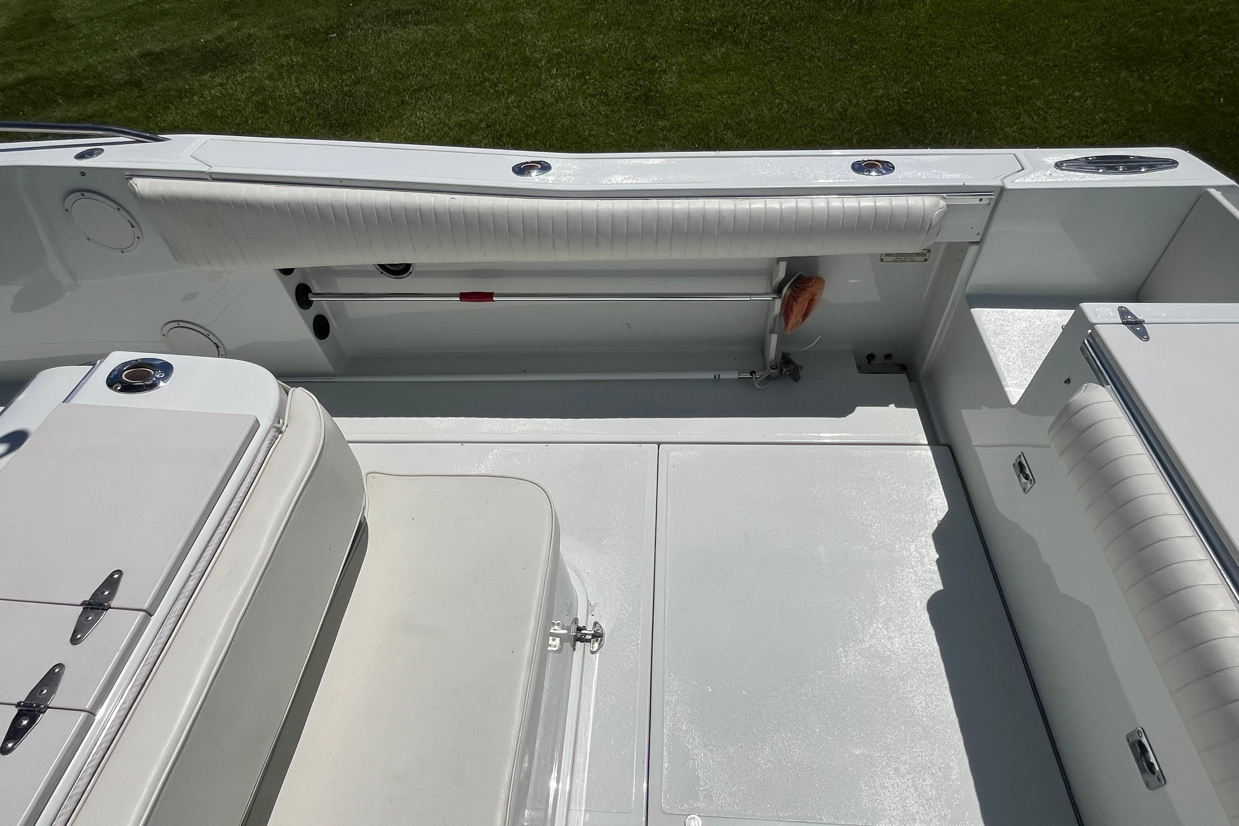 1997 Stamas boat interior with white seating and storage compartments.