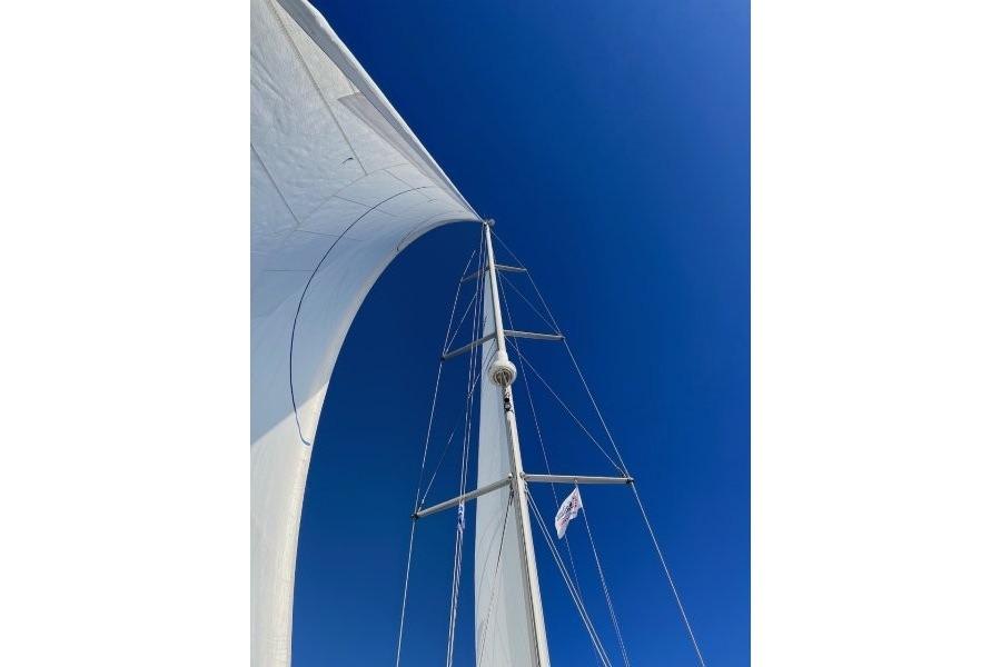 Sail of Jeanneau Sun Odyssey 54 DS yacht against clear blue sky, 2008 model.