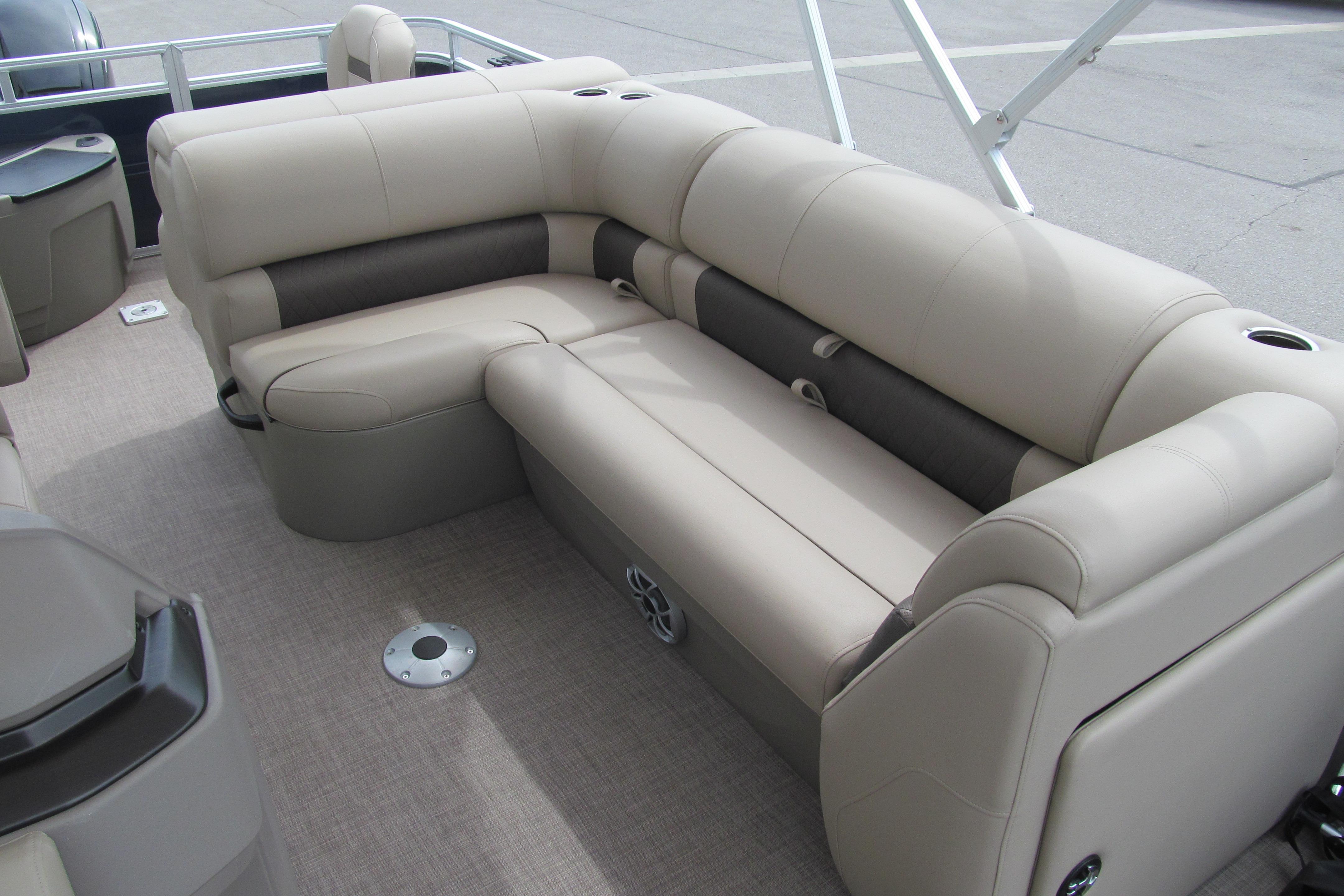 2024 Sun Tracker Fishin' Barge 20 DLX interior with plush seating and modern design.