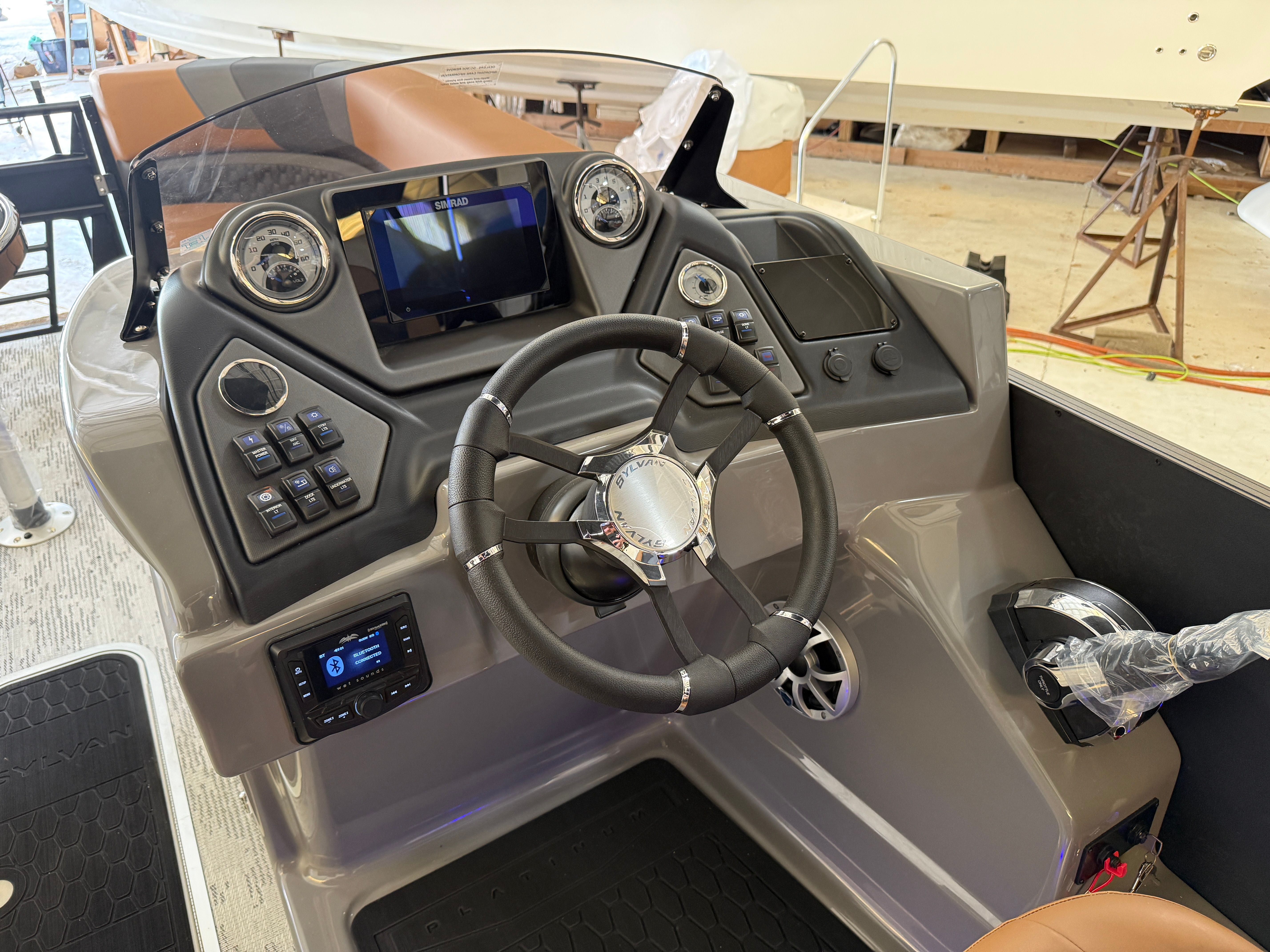 The image shows the helm of a 2026 Sylvan L3 ULZ DH boat with modern instruments.