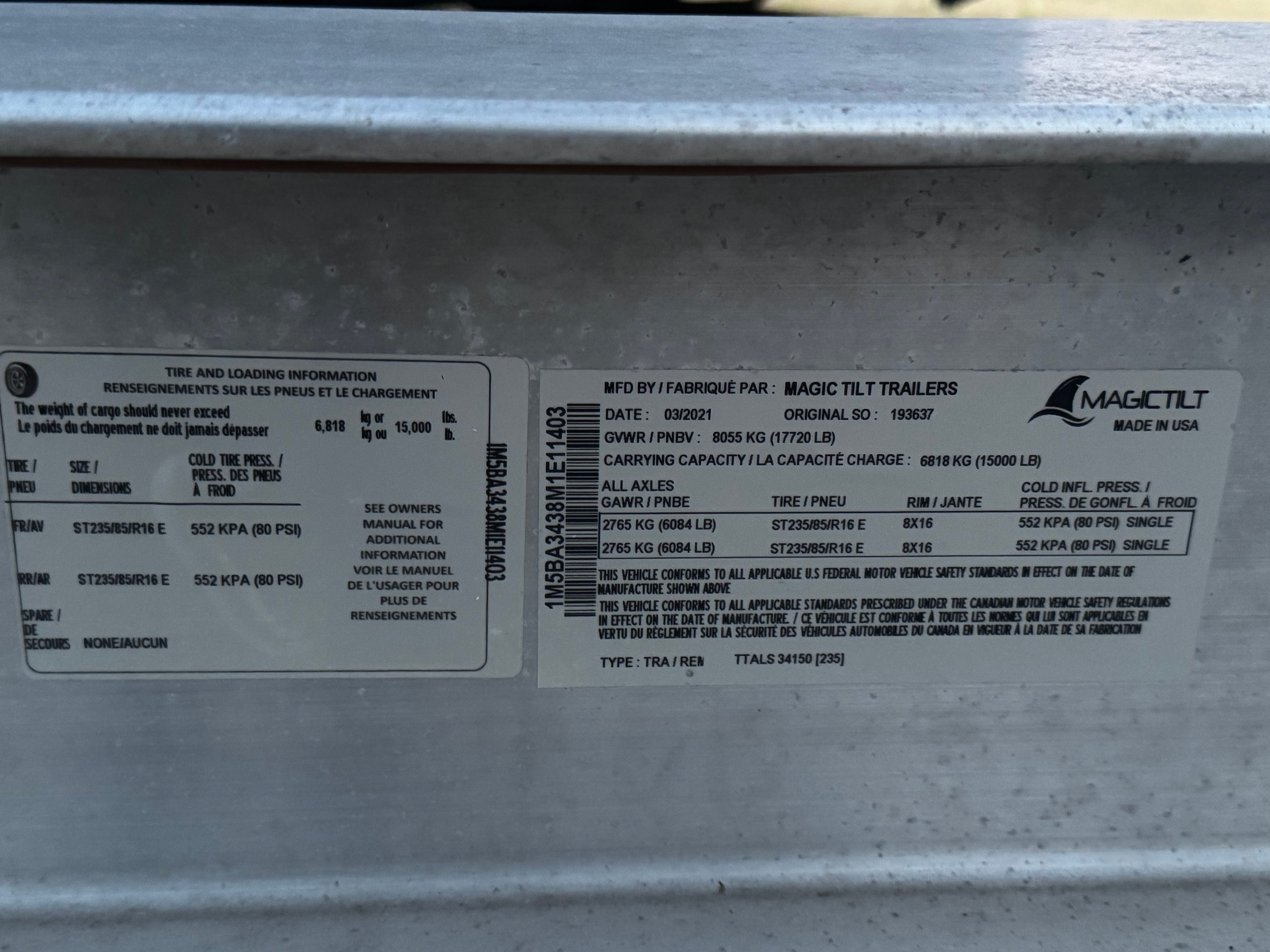 Close-up of a specification plate on a boat trailer with technical details and manufacturer information.
