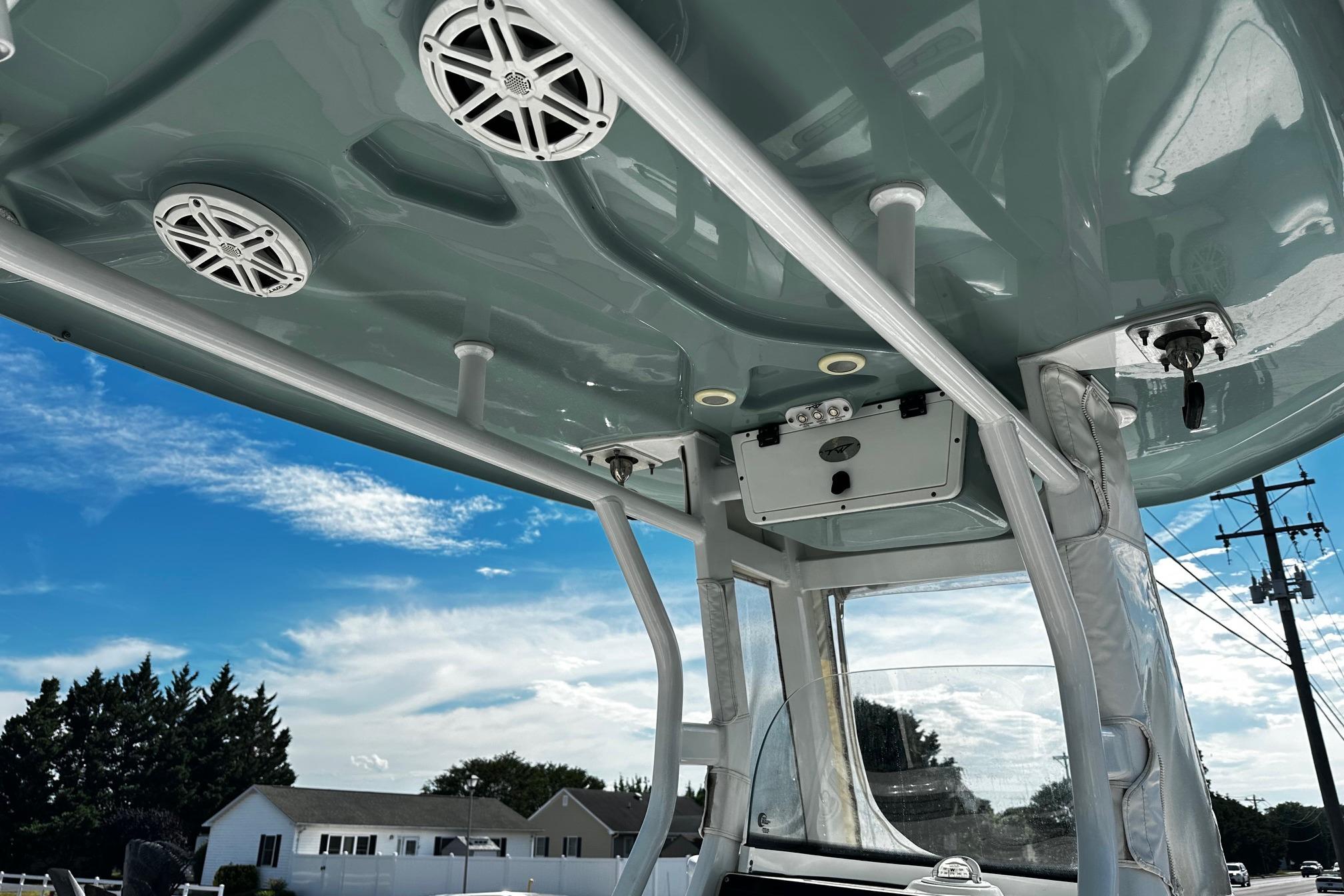 Tidewater 230 CC Adventure 2020 boat interior with speakers and clear sky background.