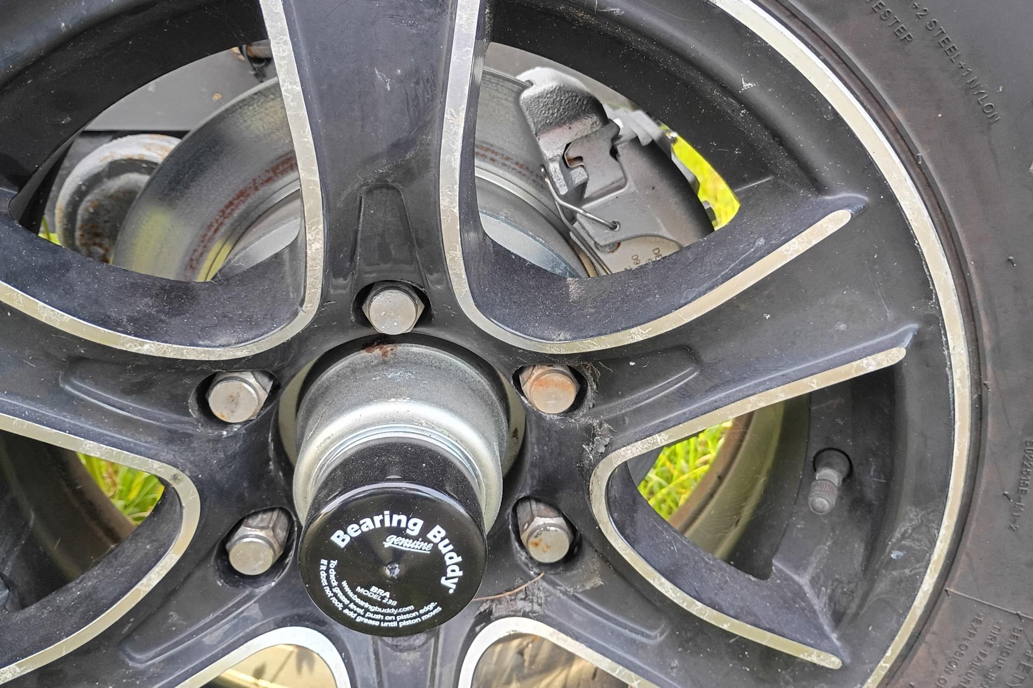 Close-up of a 2020 Costa Custom Boats 264HC wheel with Bearing Buddy hub.