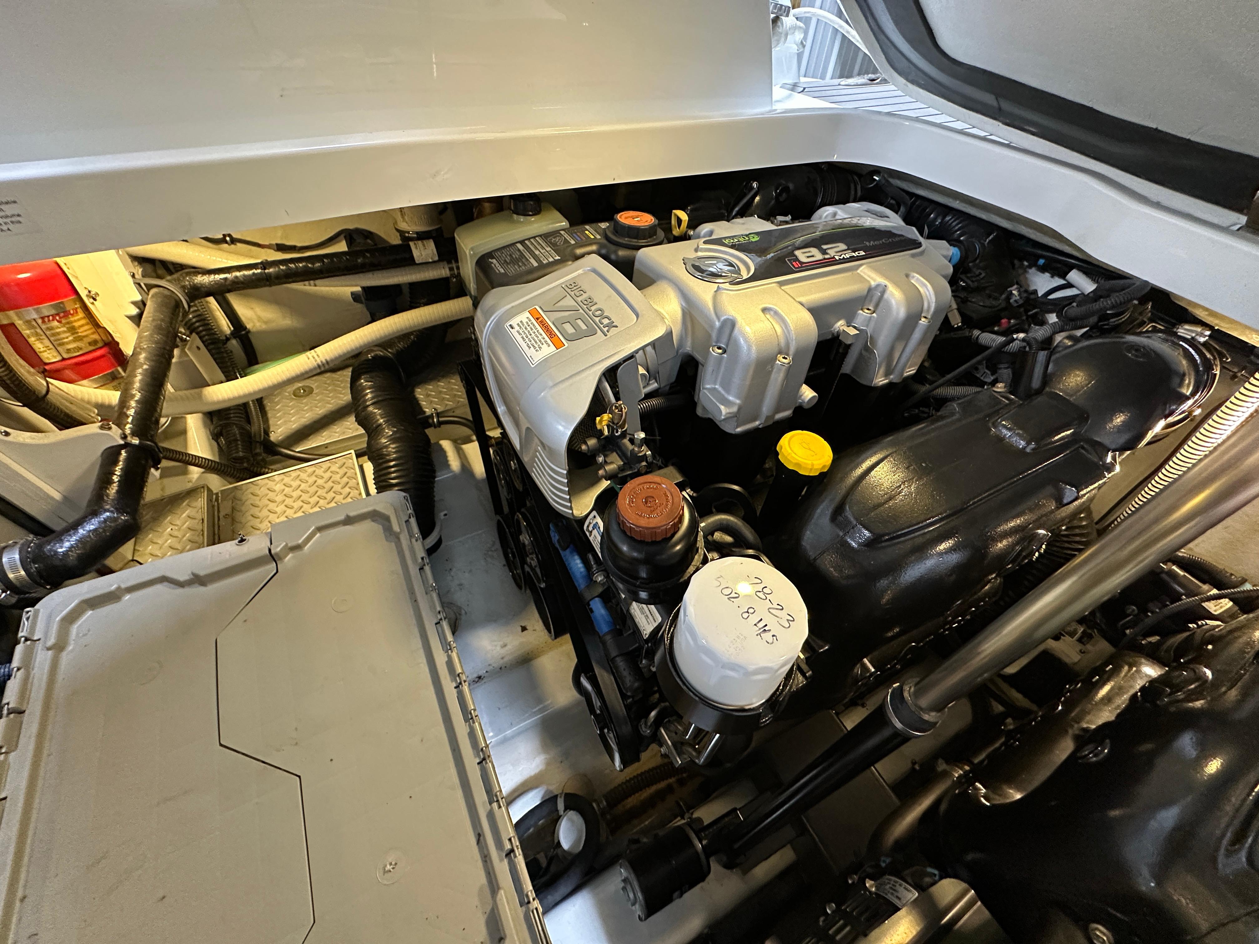 Engine compartment of a 2014 Formula 370 Super Sport boat, showcasing detailed components.