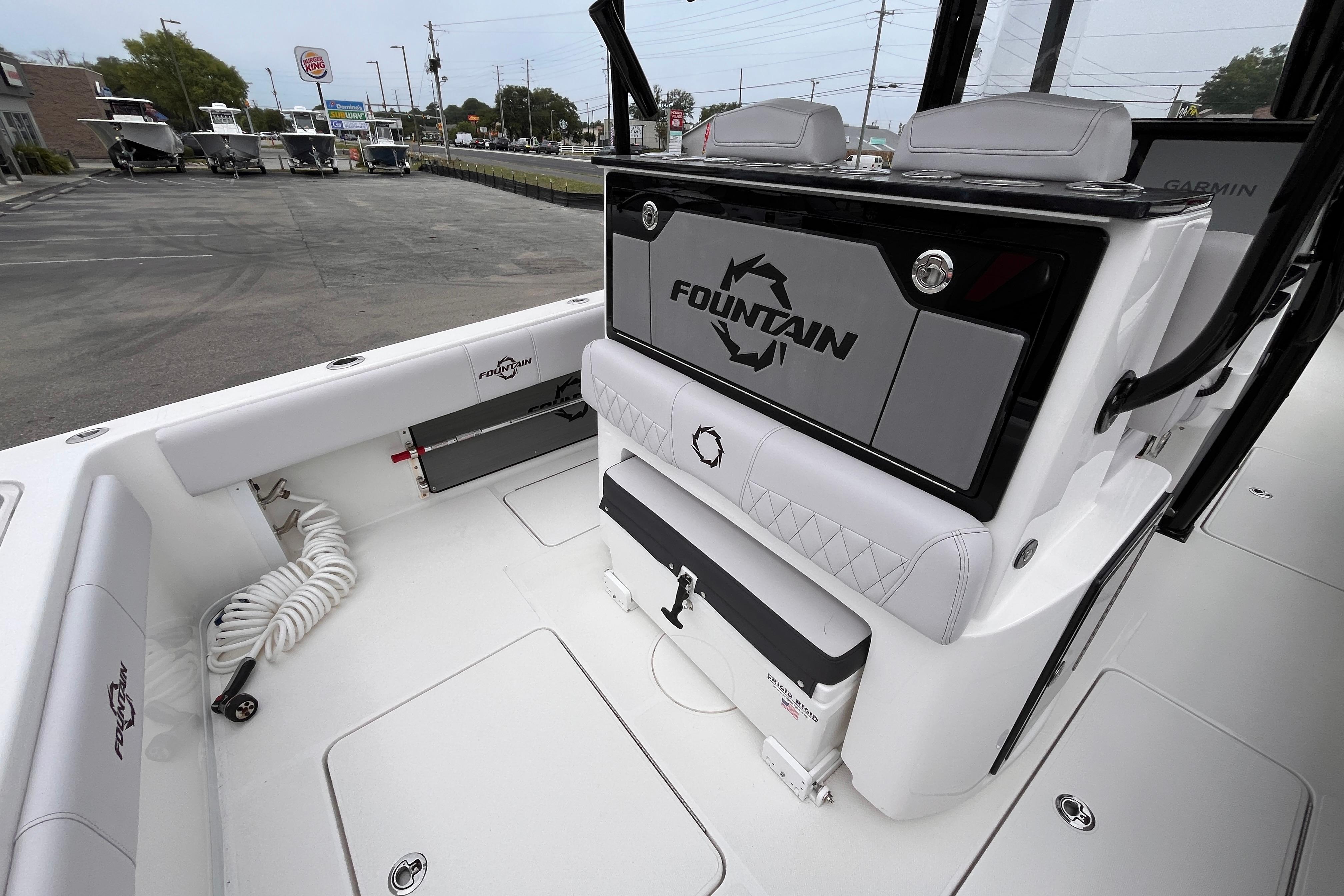 2024 Fountain 34 Tournament Edition boat interior with seating and storage compartments.