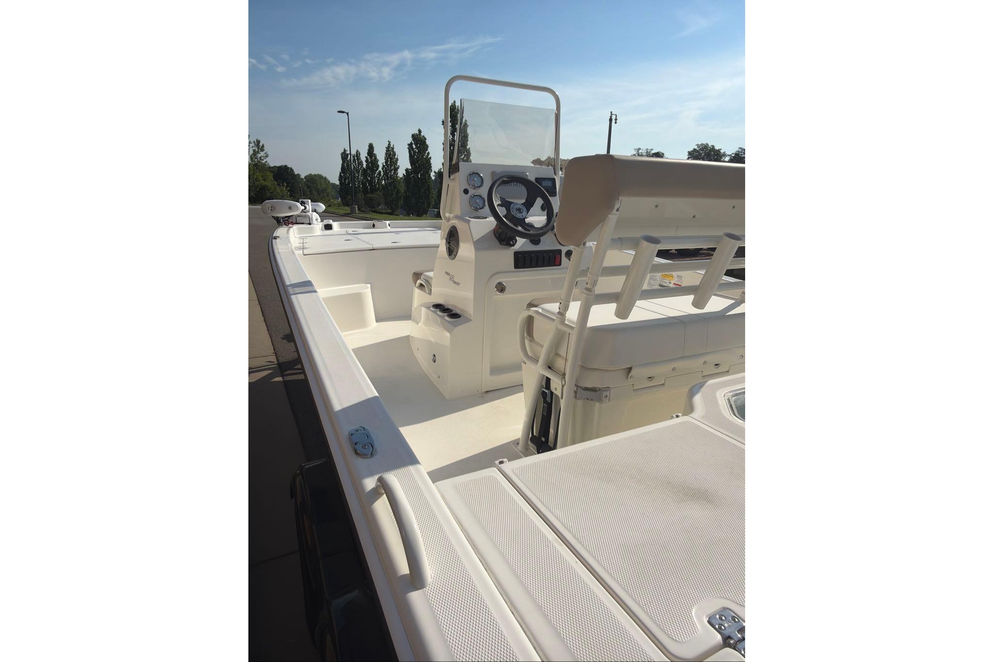 2026 Mako Pro Skiff 19 CC boat interior with steering console and seating.