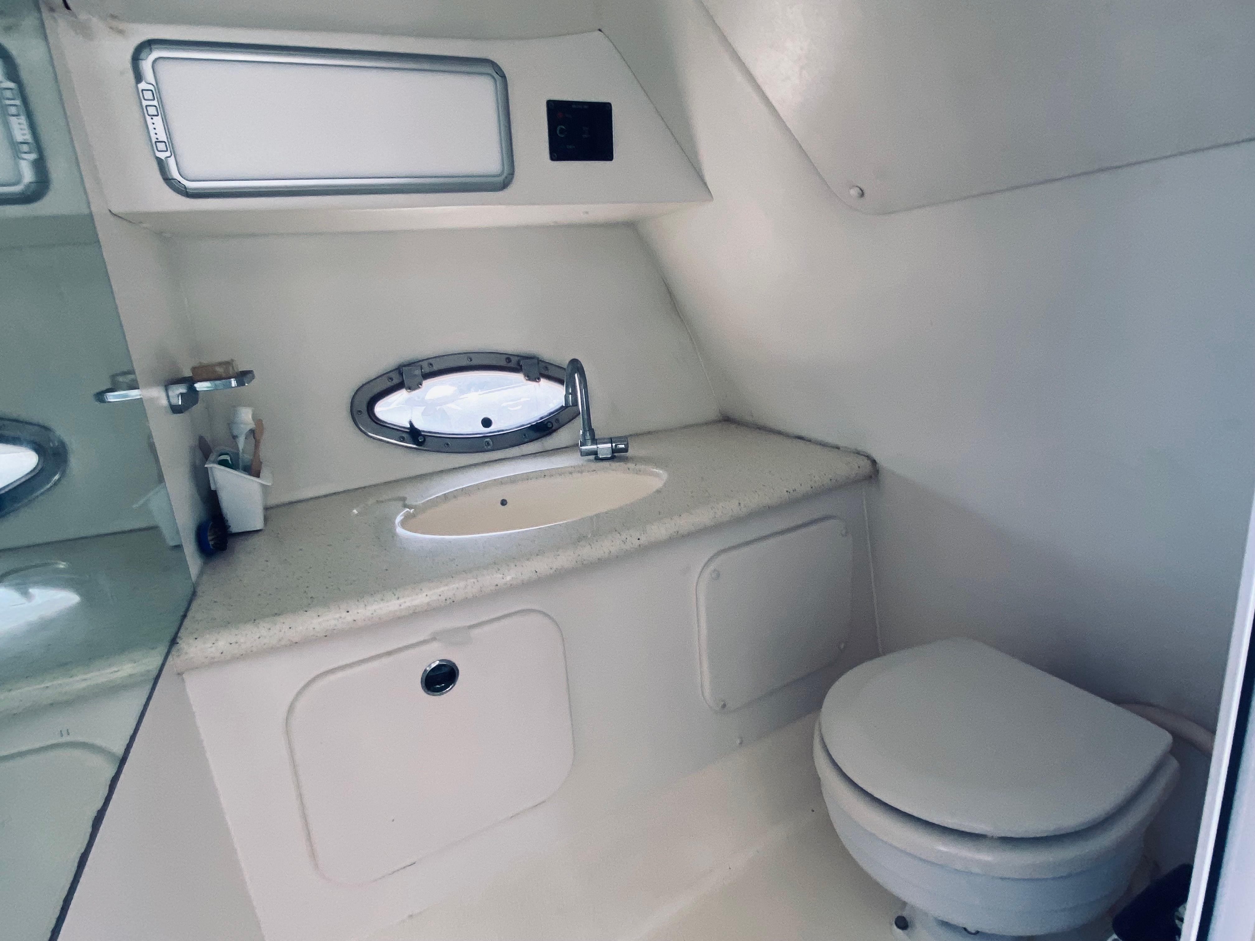 Interior of a Sunseeker Hawk 31 yacht, bathroom with sink and toilet.