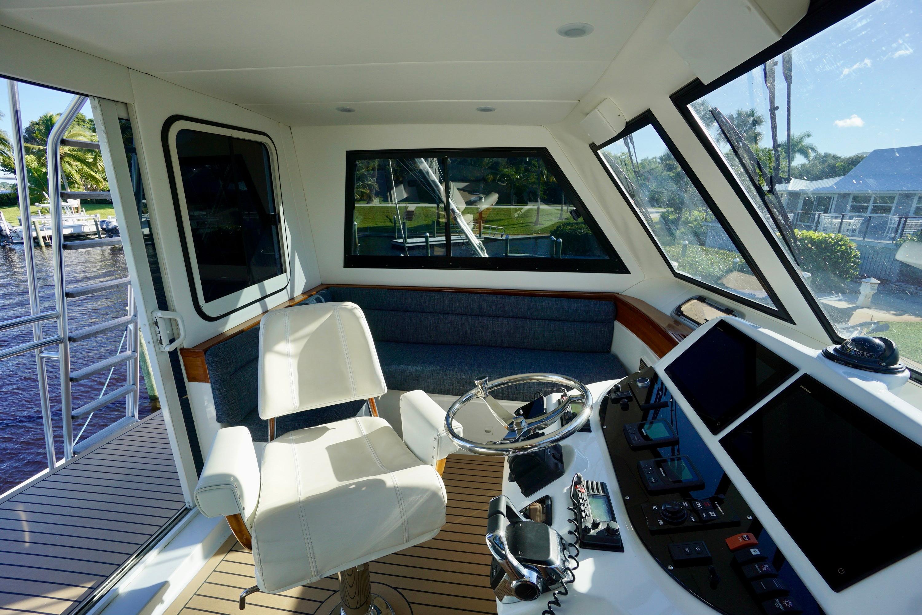 Interior of 2000 Venturer 44 yacht with helm, seating, and navigation equipment.