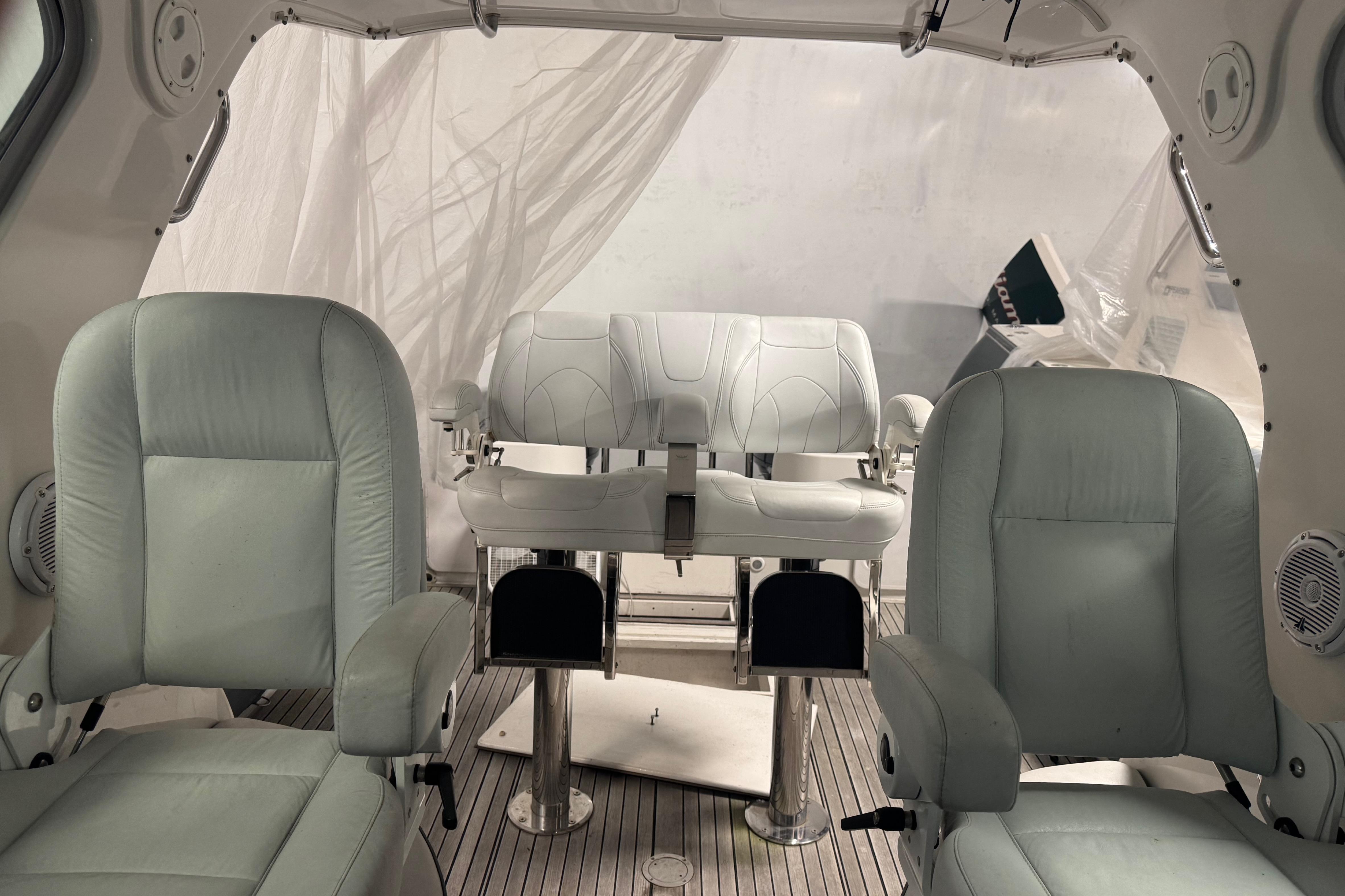 Interior of 2016 Protector Tauranga 41 boat with white leather seating.