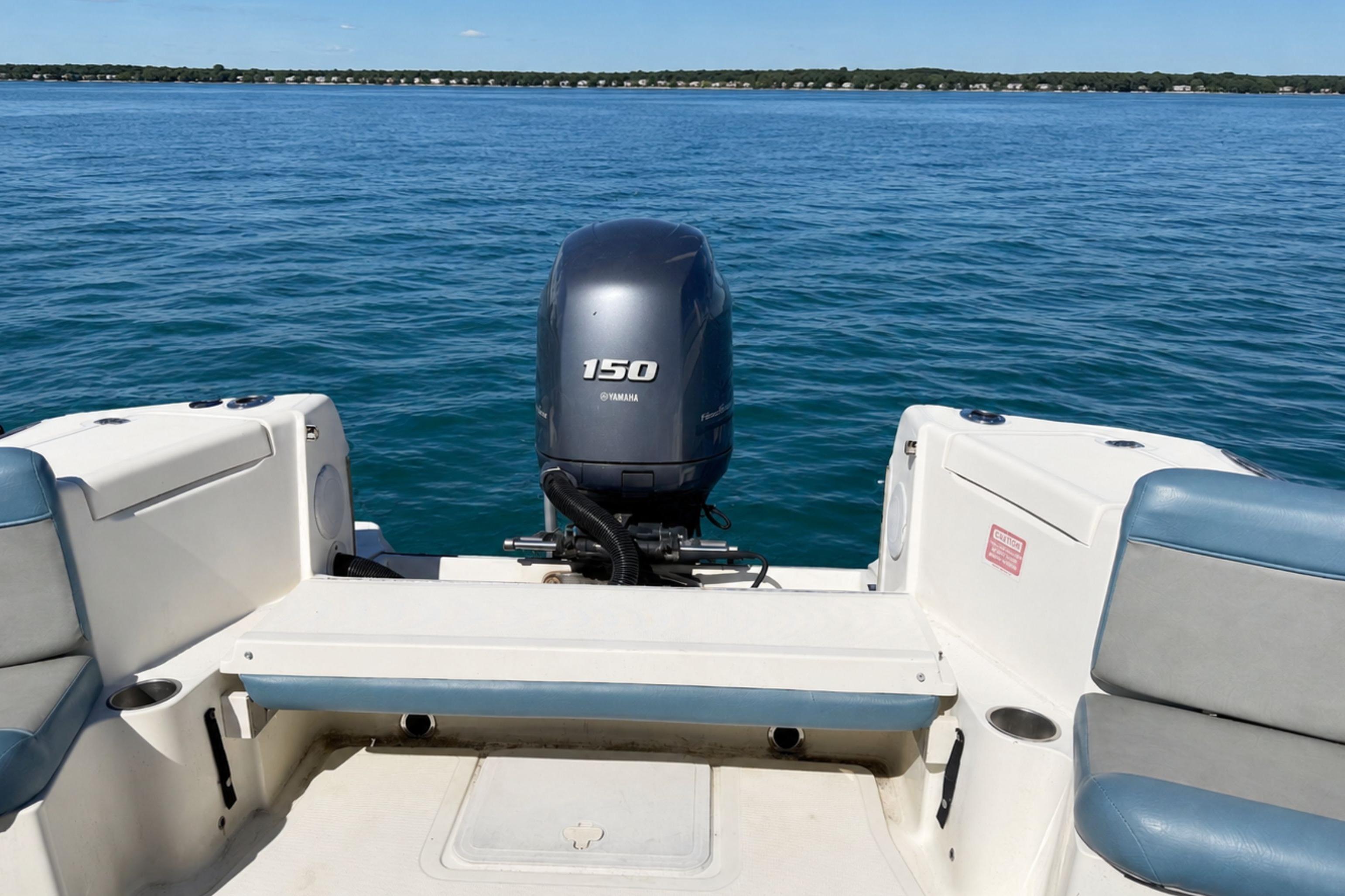 2008 Scout 222 Abaco boat with Yamaha 150 engine on calm blue water.