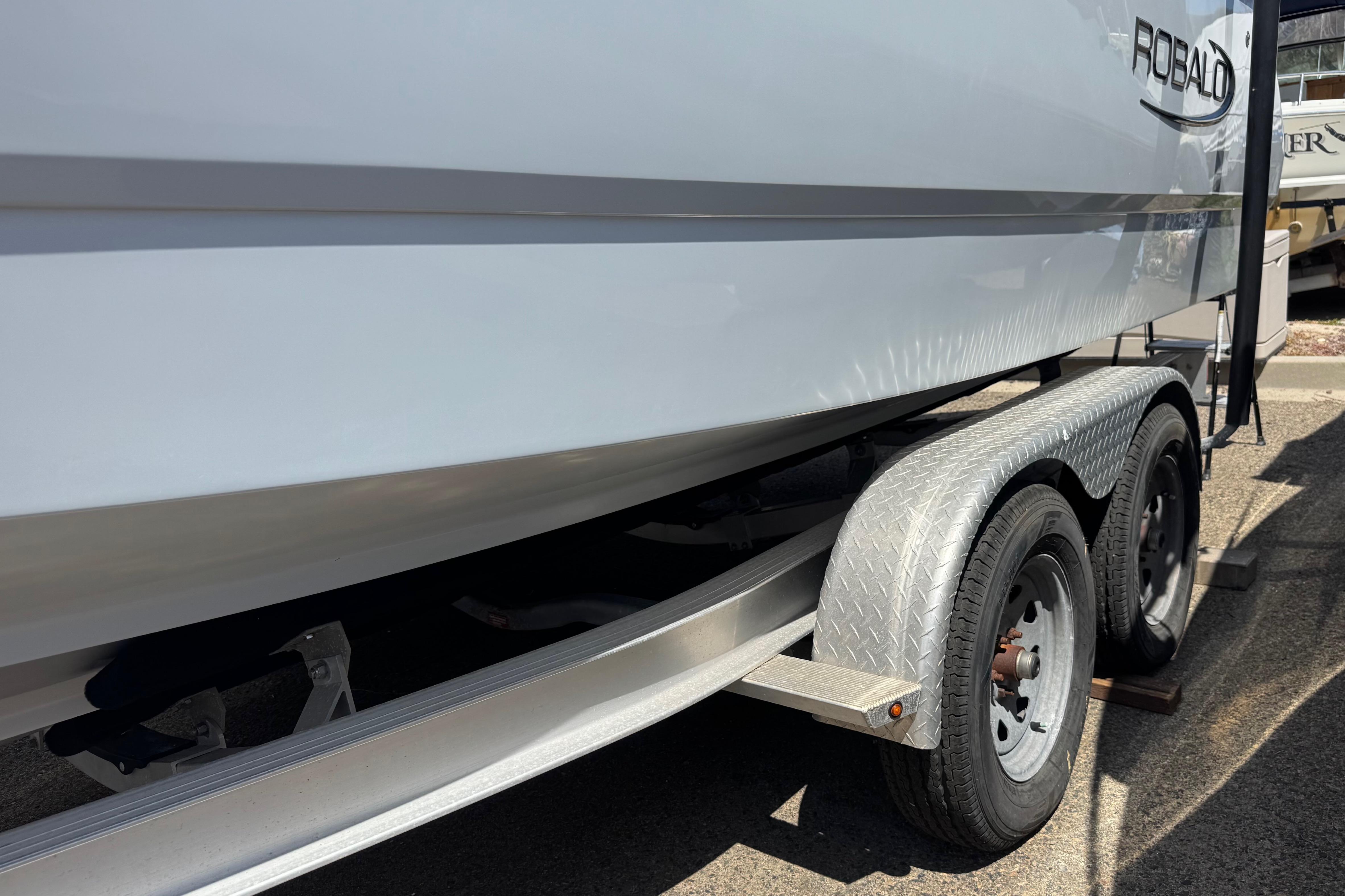 2022 Robalo R230 Center Console boat on a trailer, side view.