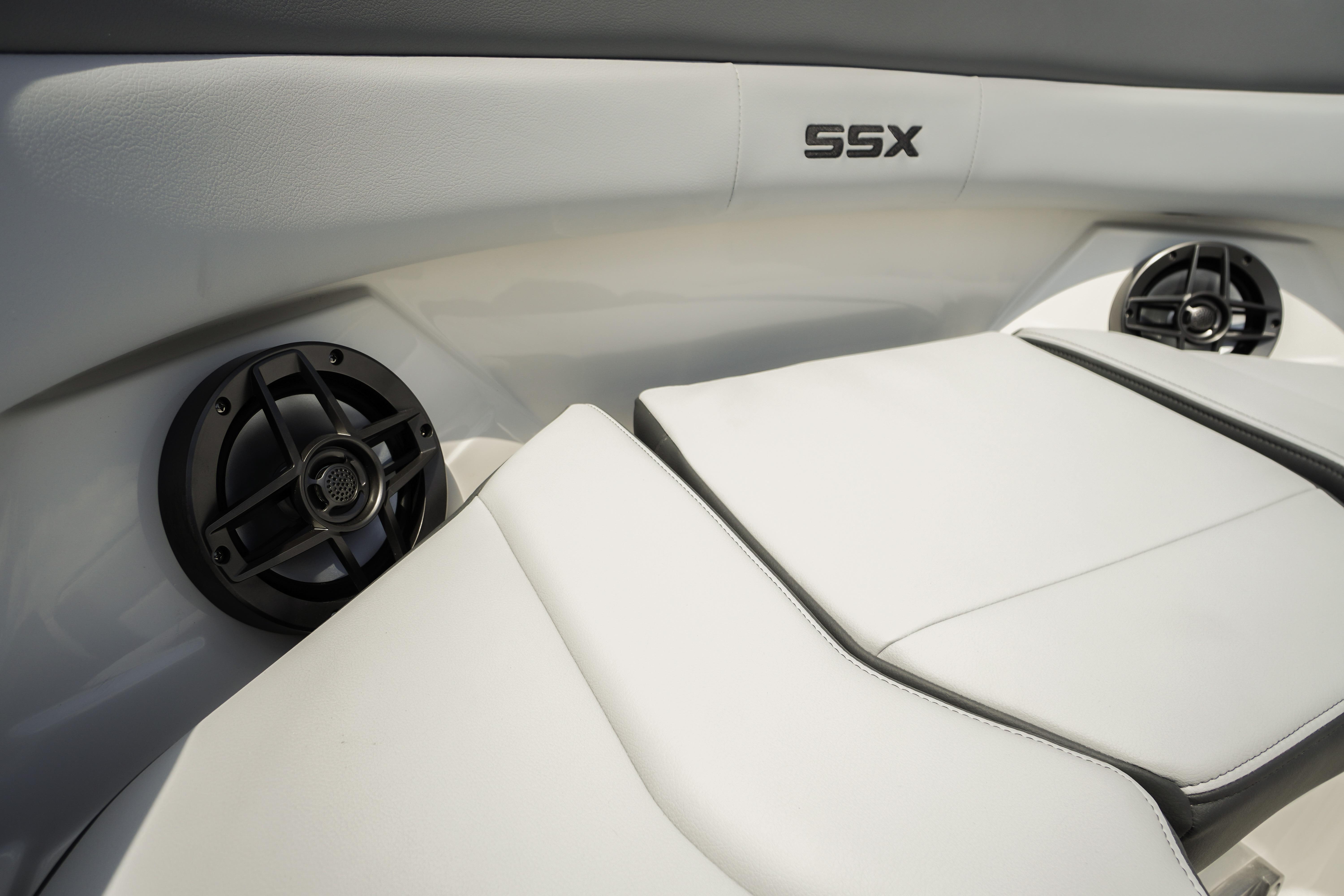 2026 Chaparral SSX 4 boat interior with white seating and built-in speakers.