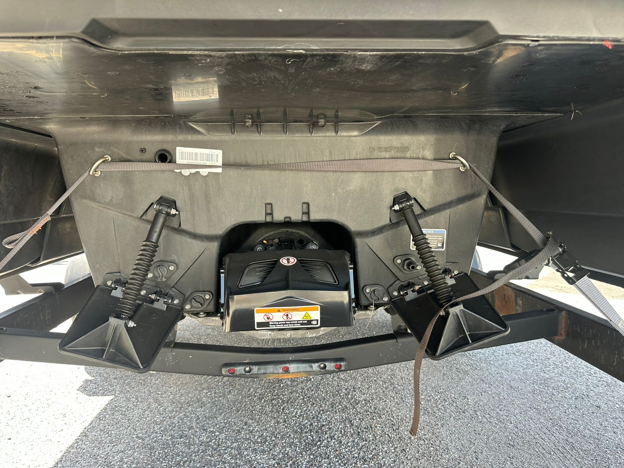 Underside of a Sea-Doo 21 SWITCH SPORT with shock absorbers and trailer hitch.