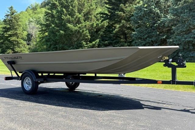 2026 Tracker Grizzly 1754 Utility boat on trailer, parked outdoors.