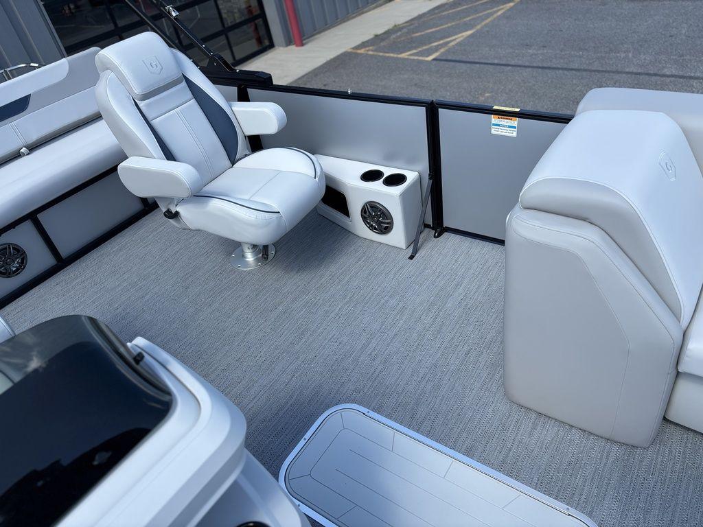 2026 Godfrey SWEETWATER 2286 SFL boat interior with seating and cup holders.