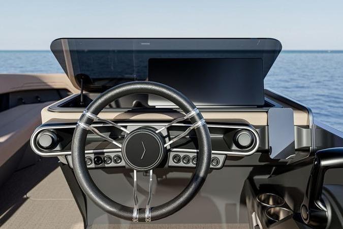 Steering wheel of 2026 Flamingo ROVE 245 boat with modern dashboard, ocean view.