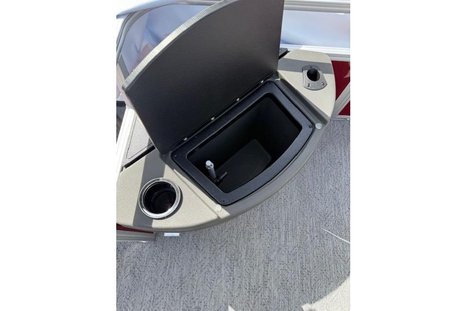 2026 Sun Tracker Bass Buggy 18 DLX boat storage compartment with cup holder.