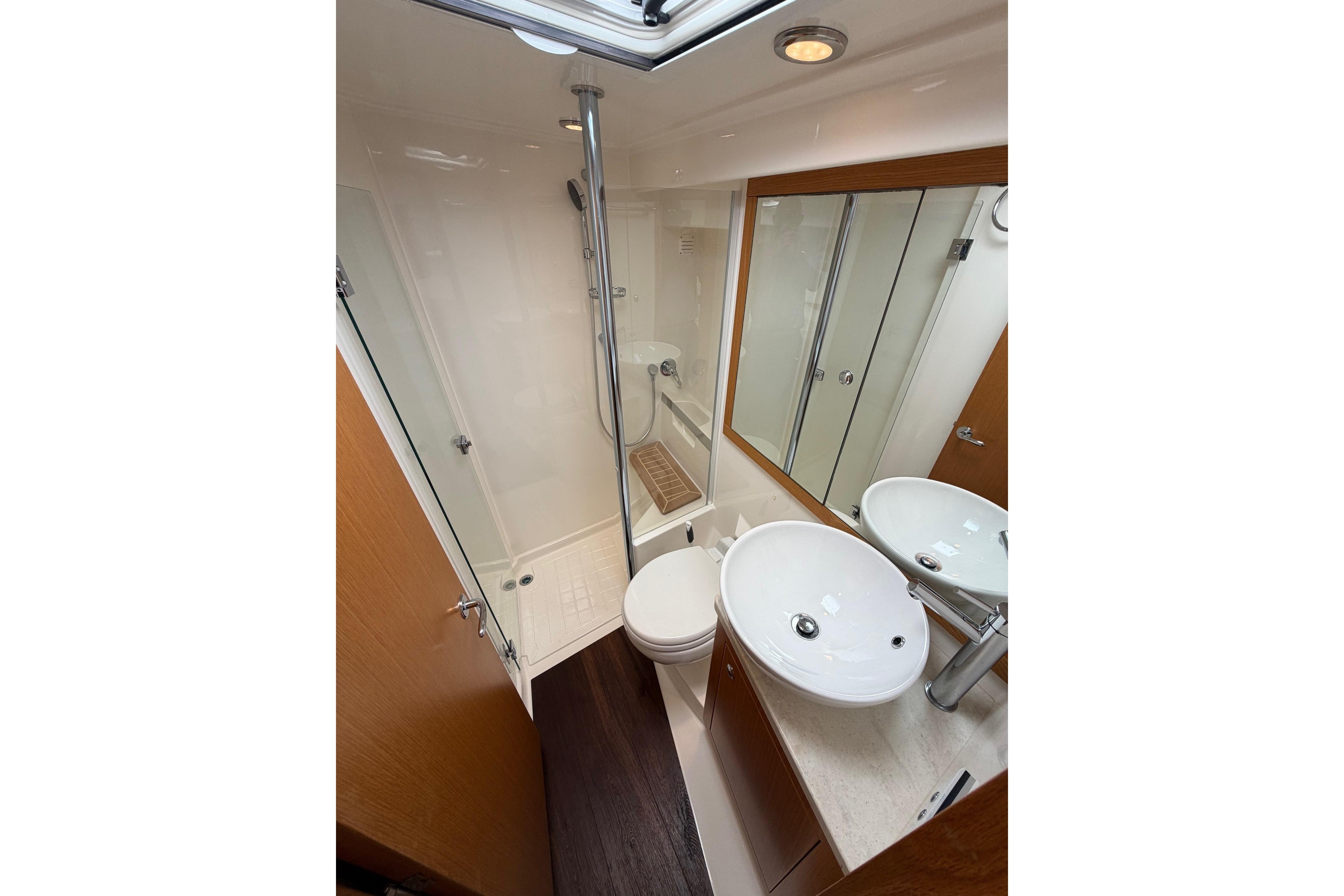 Luxurious bathroom in 2016 Riviera 445 SUV yacht with modern fixtures and elegant design.