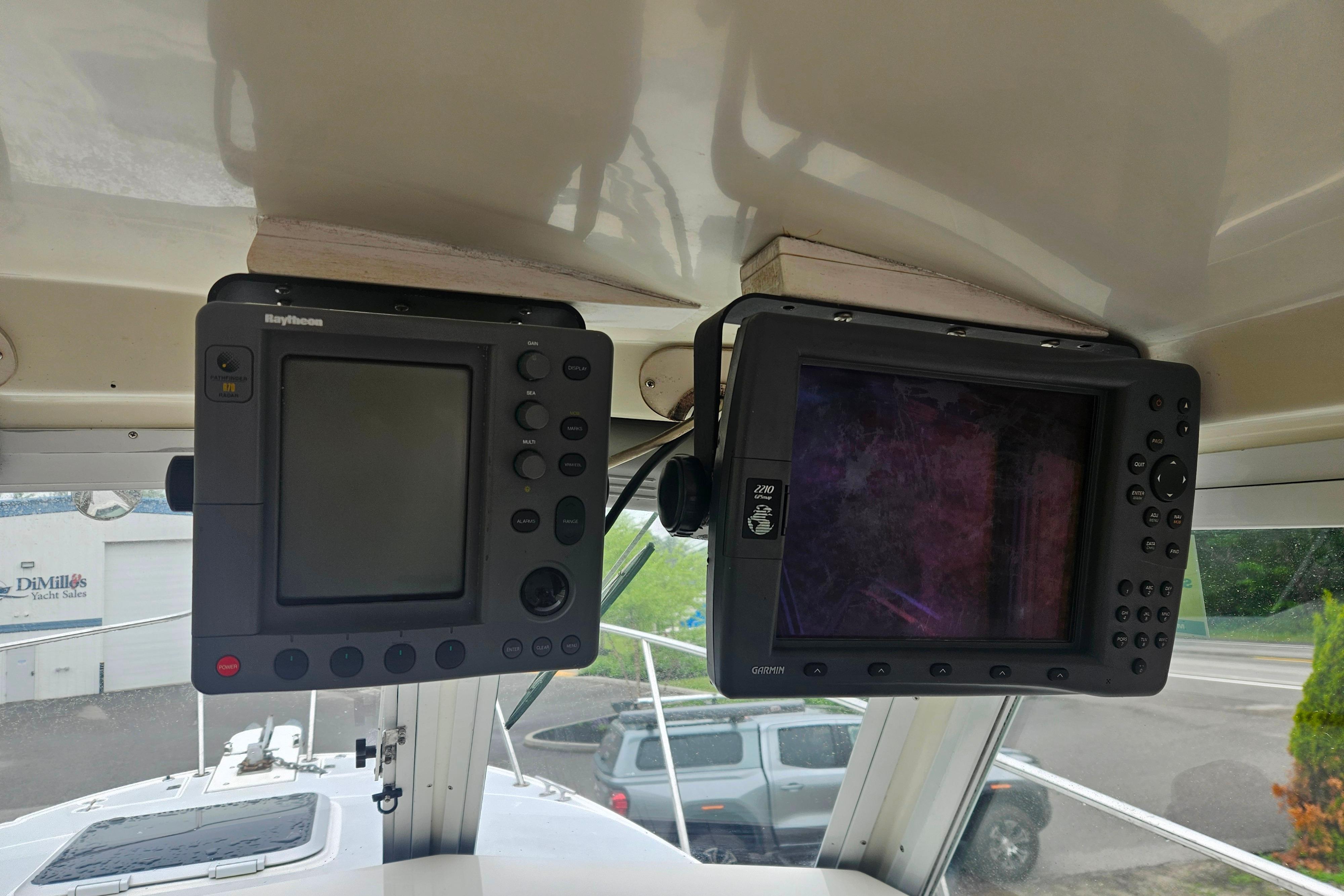 Navigation equipment inside a 1999 Albin 28 Tournament Express boat cockpit.