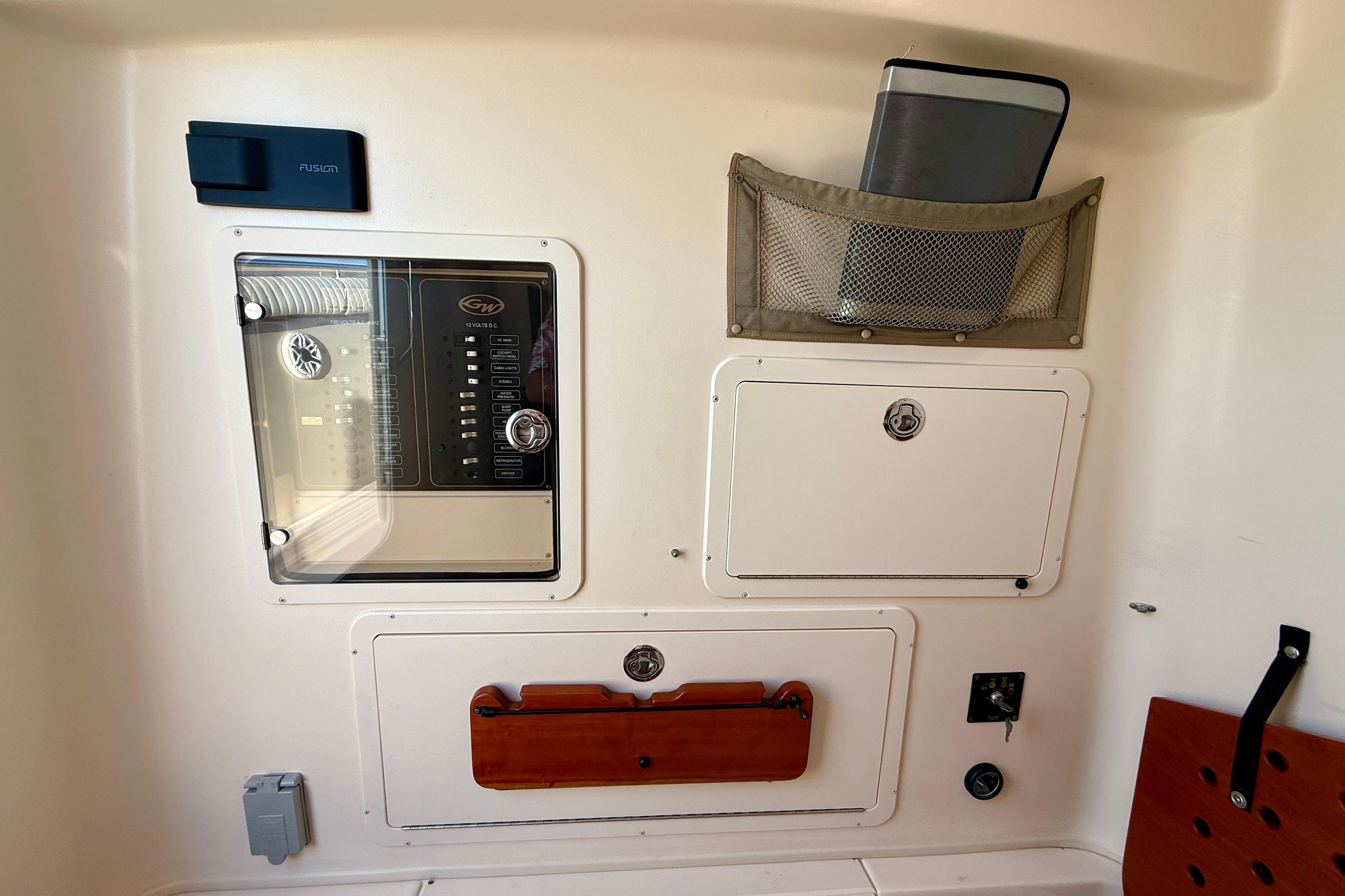 Control panel and storage compartments on a 2012 Grady-White Canyon 336 boat.