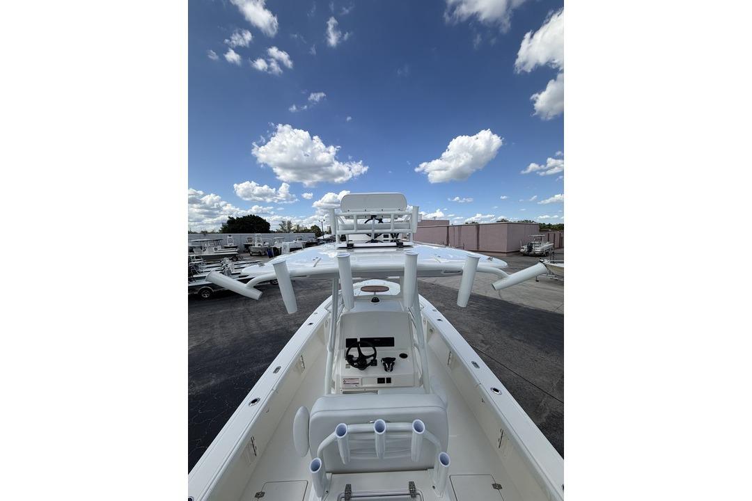2026 Pathfinder 2800 Hybrid boat with clear sky and clouds in the background.