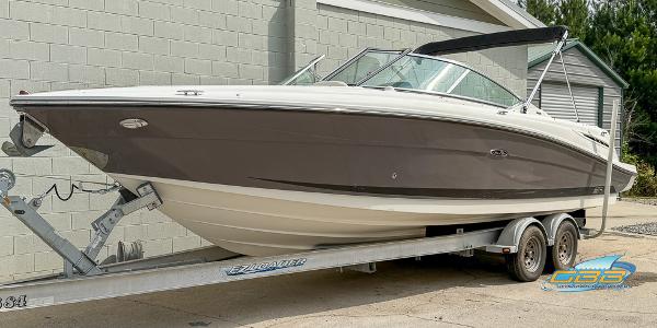 2008 Sea Ray 270 SLX boat on trailer, parked outdoors.