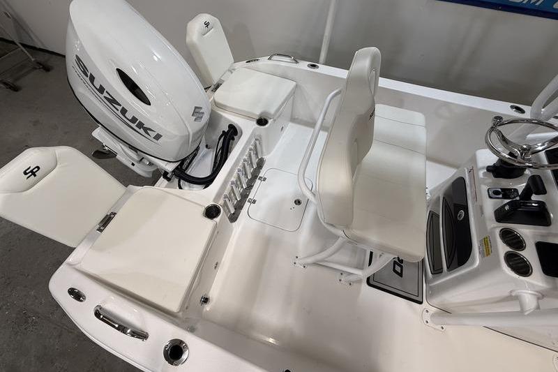 2026 Sea Pro 202 Center Console boat interior with Suzuki engine, white seating, and control panel.