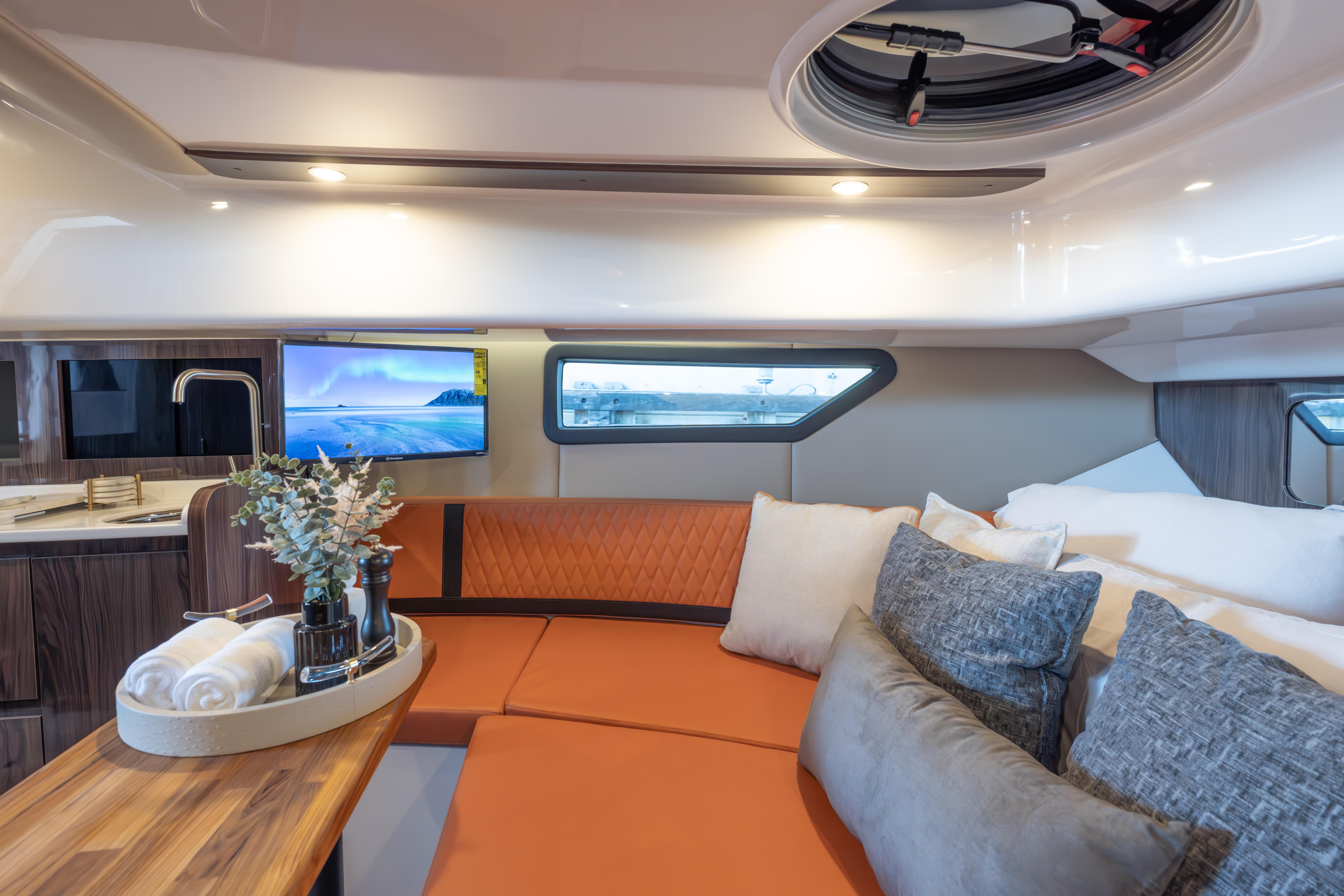 Luxurious interior of 2026 Hanover 387 yacht with modern seating and decor.