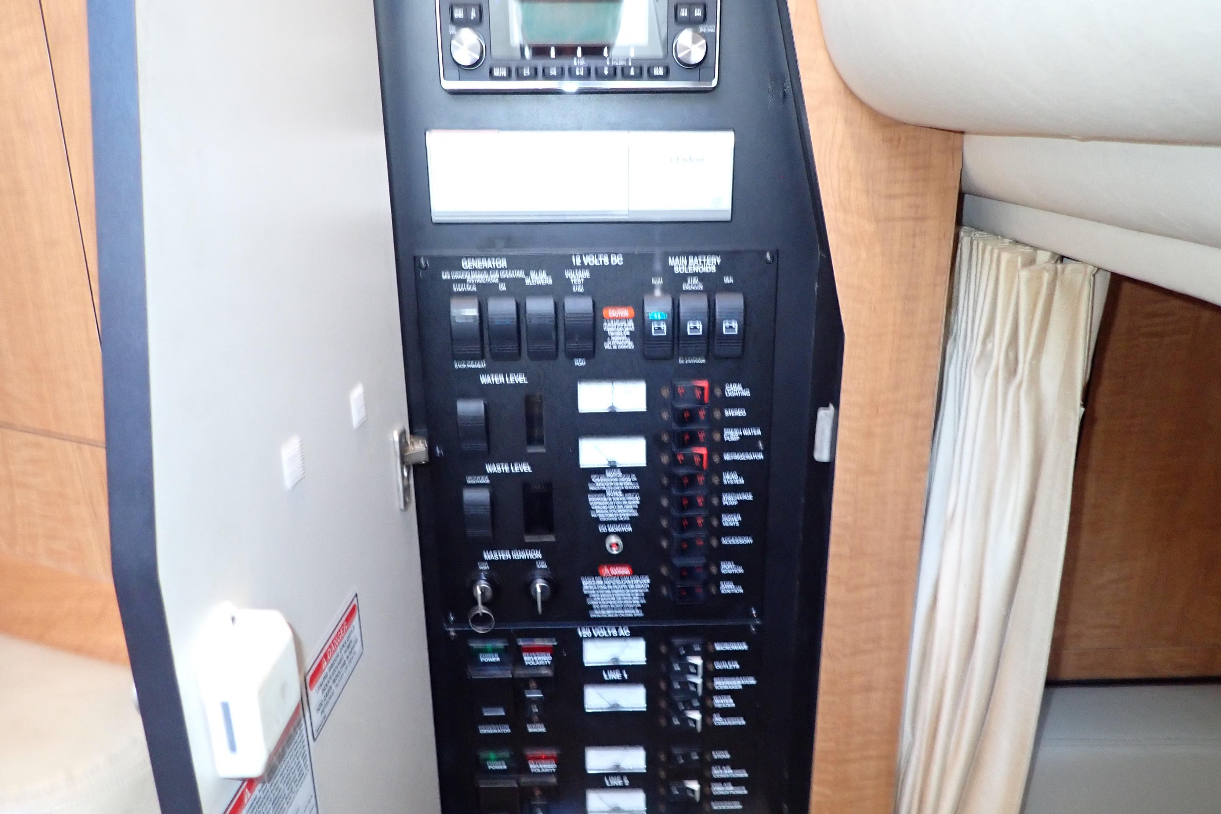 Electrical control panel inside 2006 Sea Ray 340 Sundancer yacht cabin.