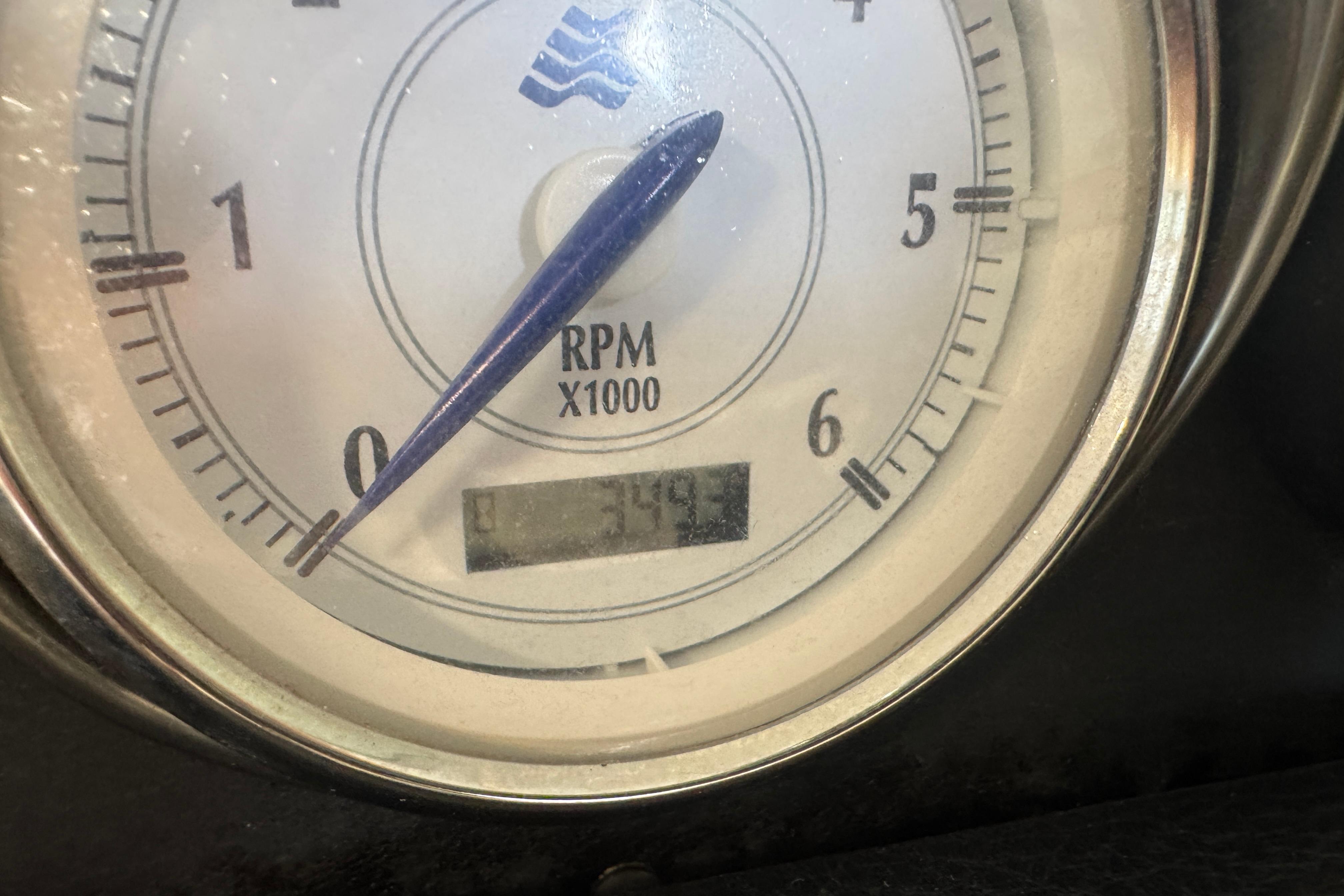 Close-up of a 2008 Four Winns H240 tachometer showing RPM gauge.