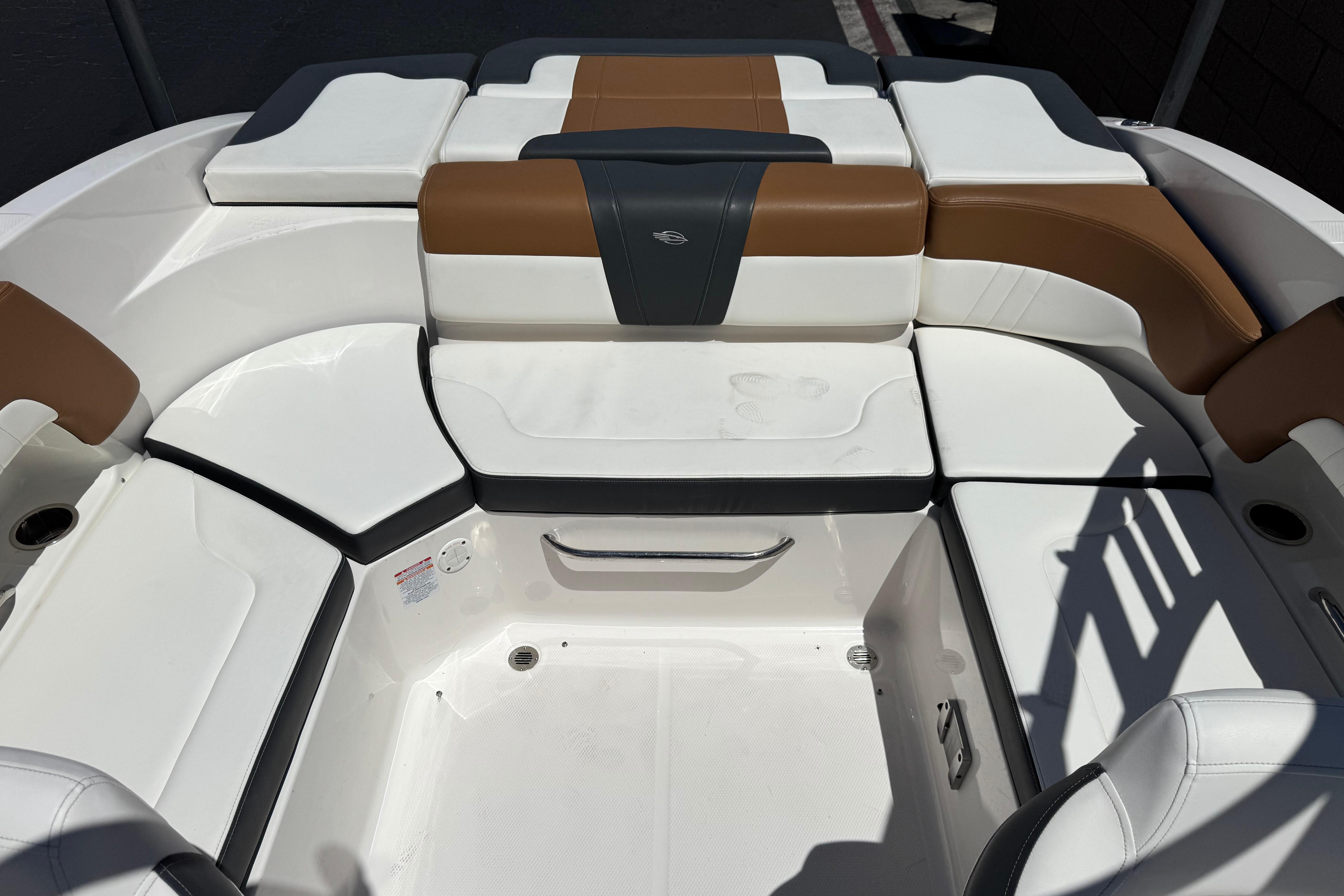 2023 Chaparral 23 SSi boat interior with white and brown seating arrangement.