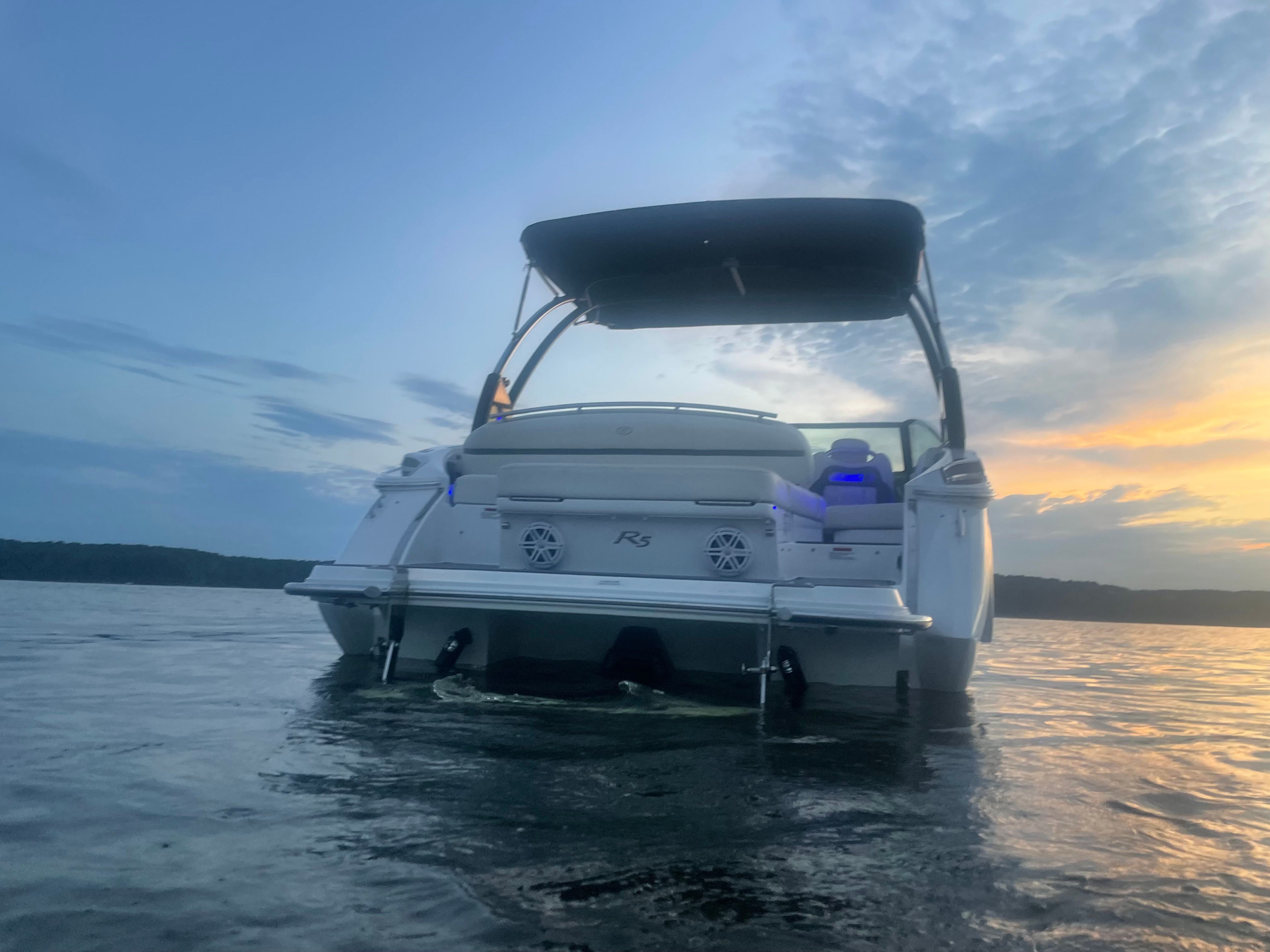 2017 Cobalt R5 boat on water at sunset.