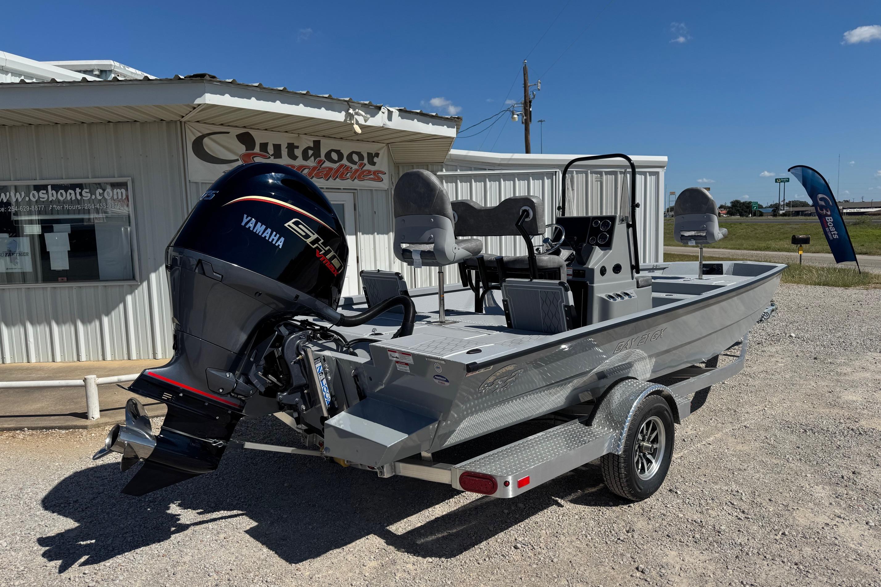 2026 G3 21GX boat with Yamaha engine, parked outside Outdoor Specialties.