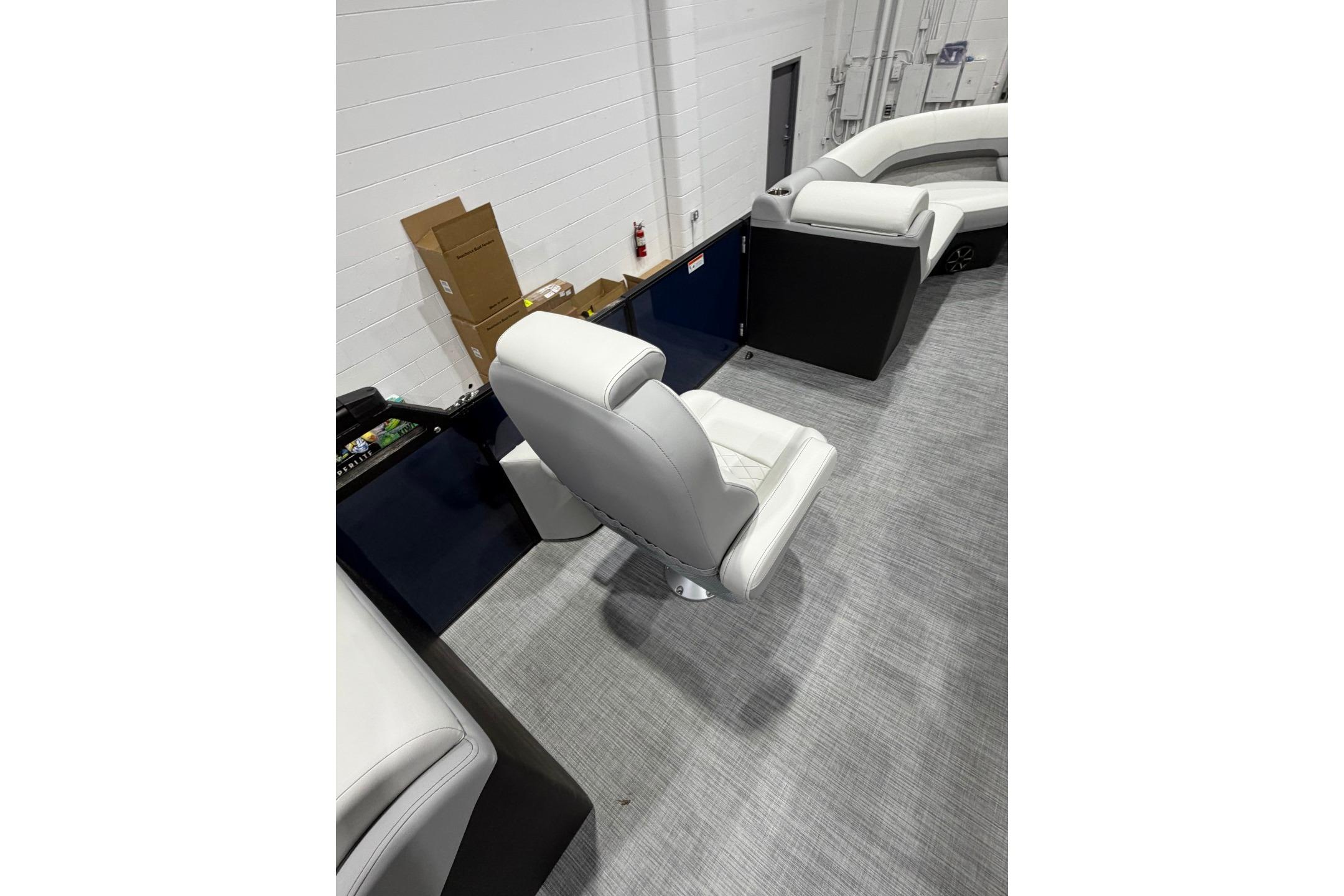 Interior of 2026 Lowe SS 230 WT boat featuring white seating and modern design.