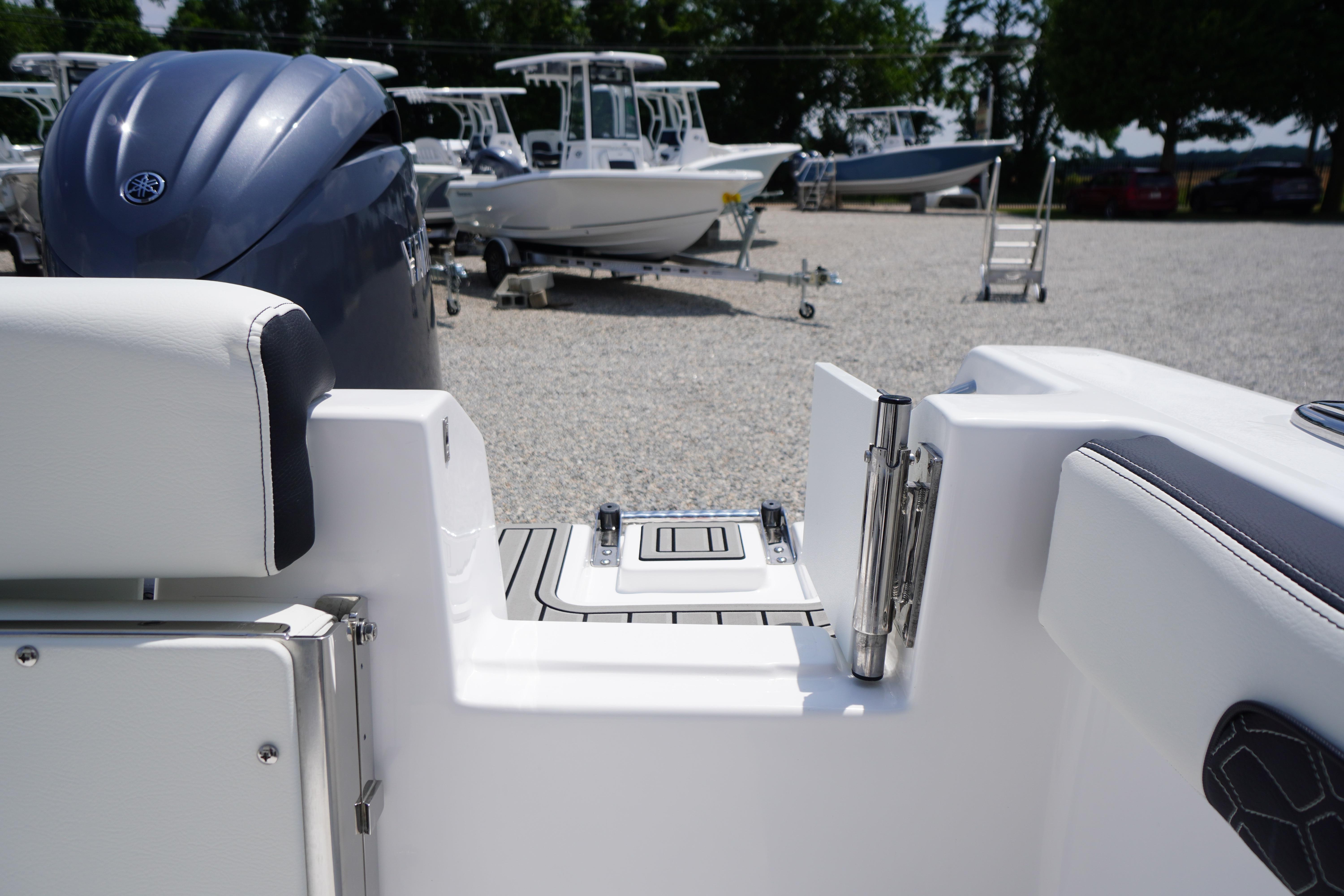 2027 Tidewater 220 CC Adventure boat with Yamaha engine in a marina setting.