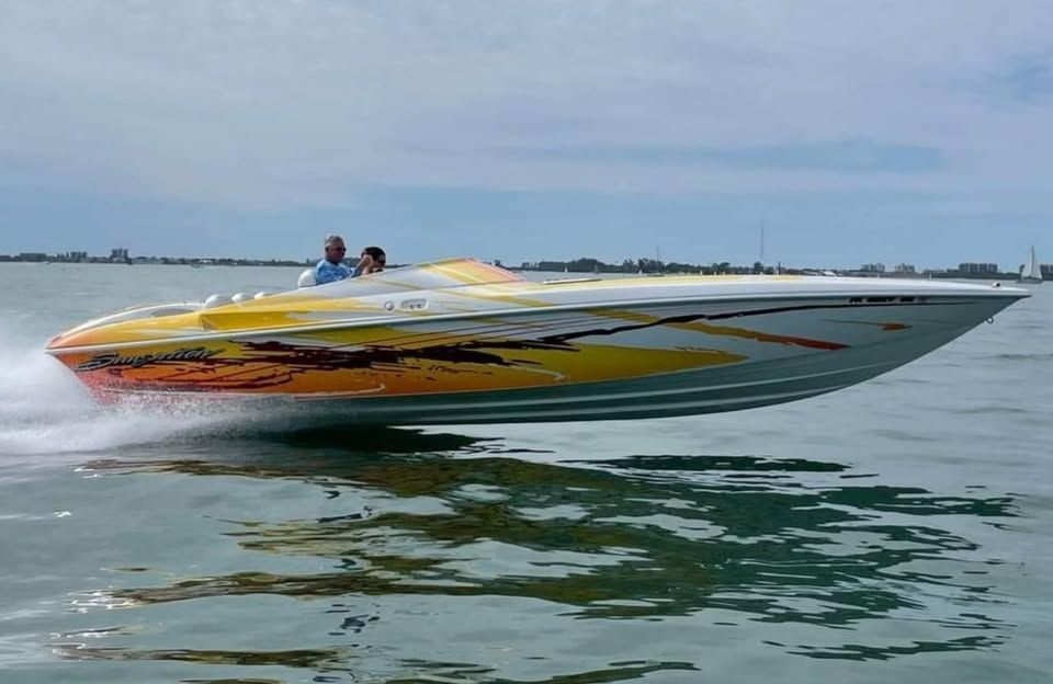 2003 Sunsation 32 Dominator speedboat on the water.