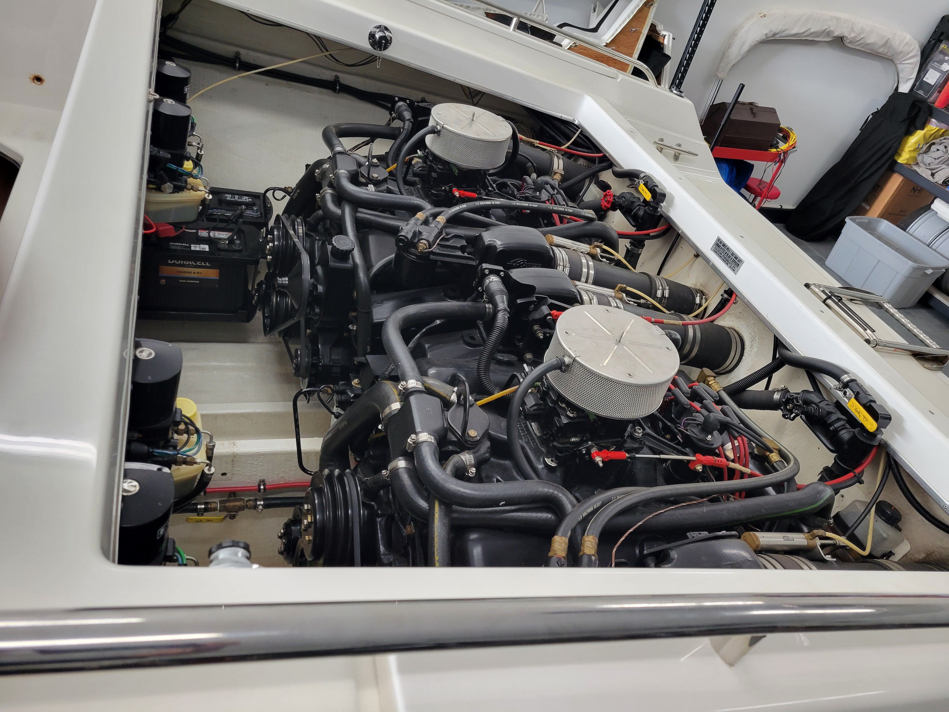 Engine compartment of a 1992 Fountain Fever boat, showcasing dual engines and mechanical components.