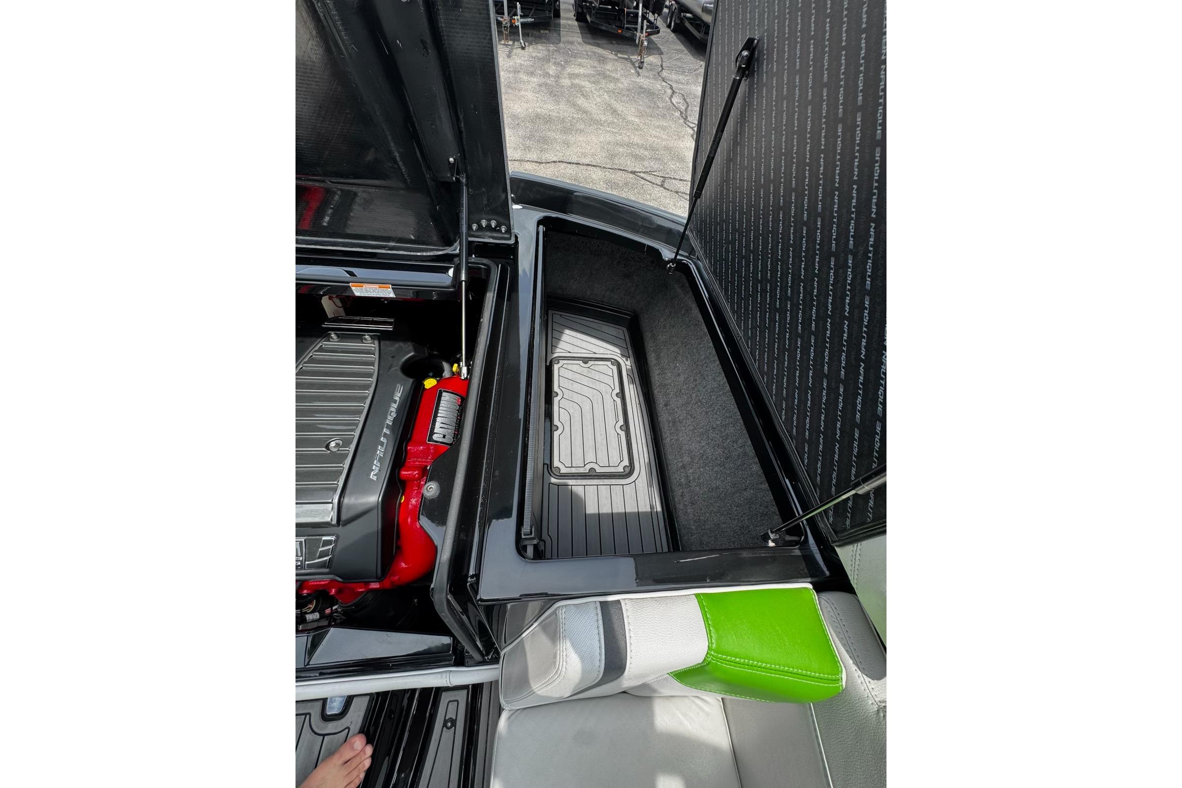 Open engine compartment of 2014 Nautique Super Air Nautique G21 boat.