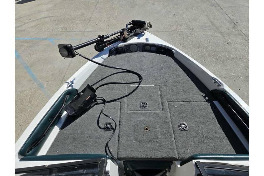 1997 Javelin 389 FS boat deck with trolling motor and carpeted surface.