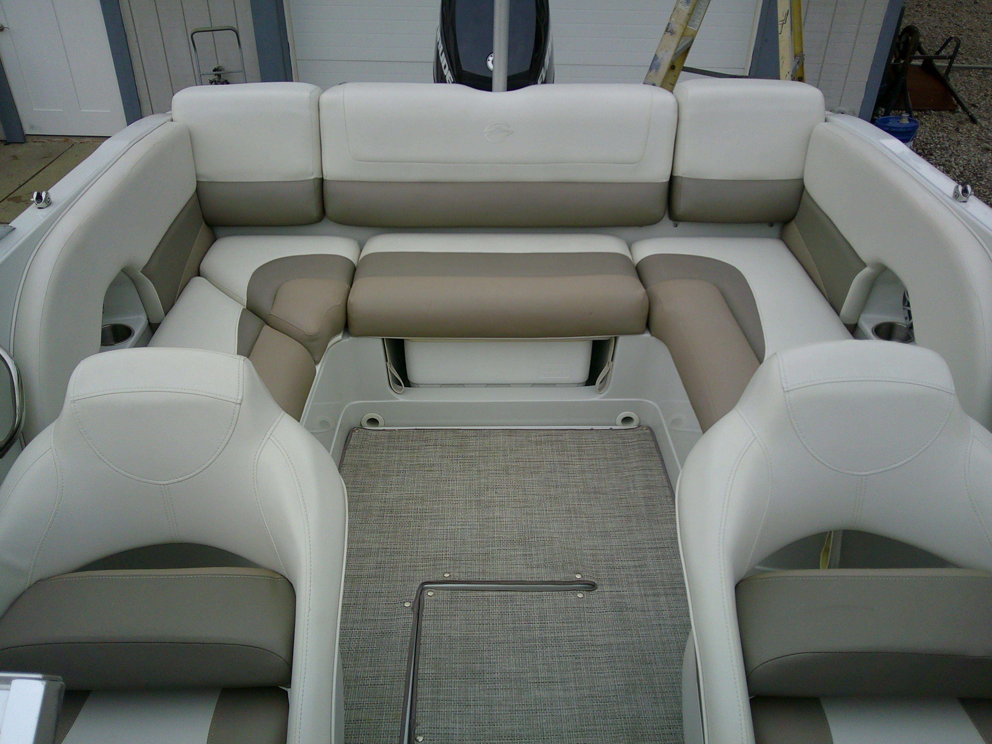 2019 Crownline 19 XS boat interior with beige and white seating arrangement.