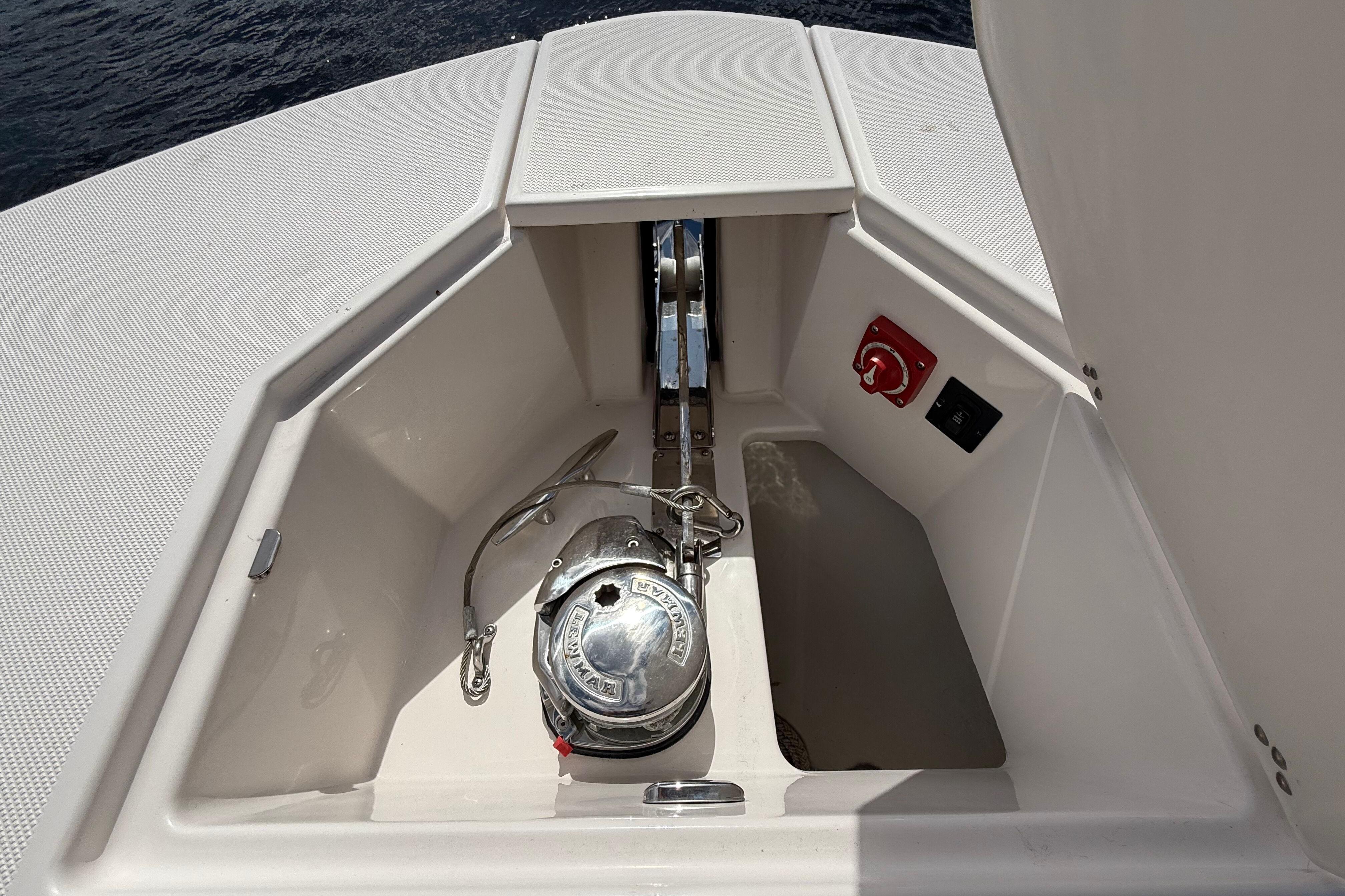 2020 Regal 38 SAV boat anchor compartment with winch and control panel.