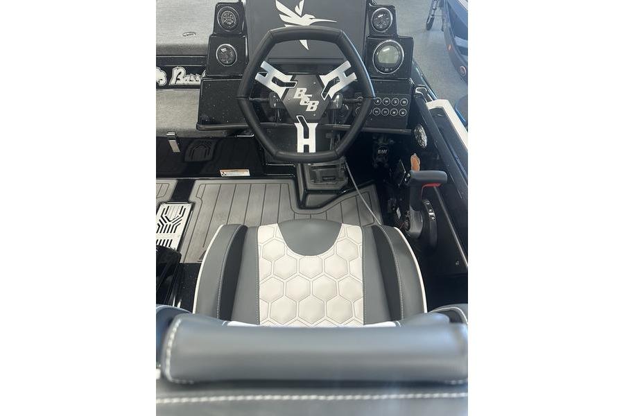 2026 Bass Cat Lynx STS boat interior with steering wheel and hexagonal seat design.