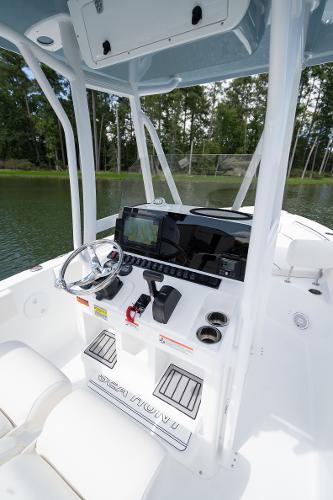 2024 Sea Hunt Ultra 234 boat console with steering wheel and navigation system.